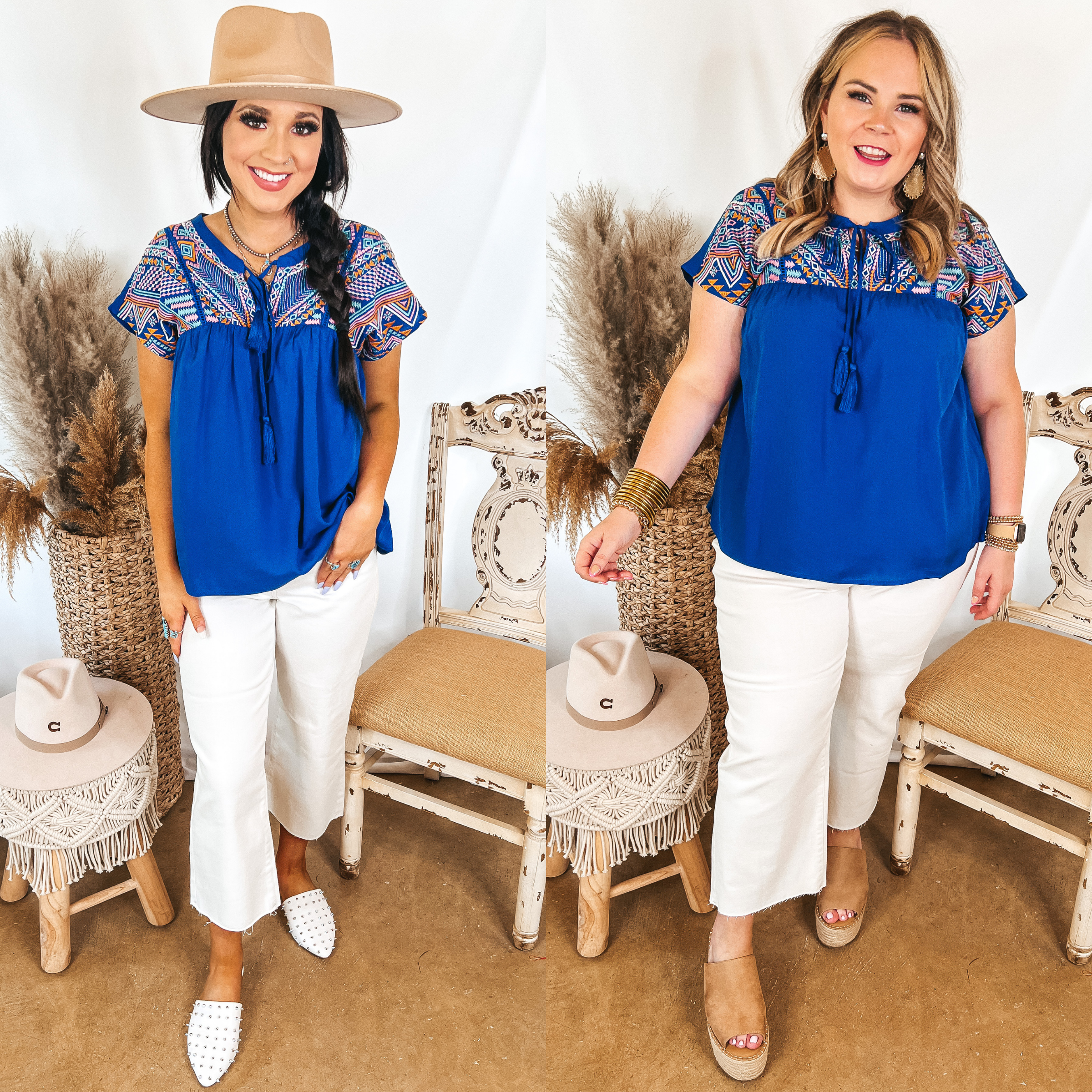 Models are wearing a blue short sleeve top that is embroidered on the upper. Both models have it paired with white cropped jeans. Size small model has it paired with white mules, silver jewelry, and a tan hat. Size large model has it paired with tan mules and gold jewelry.