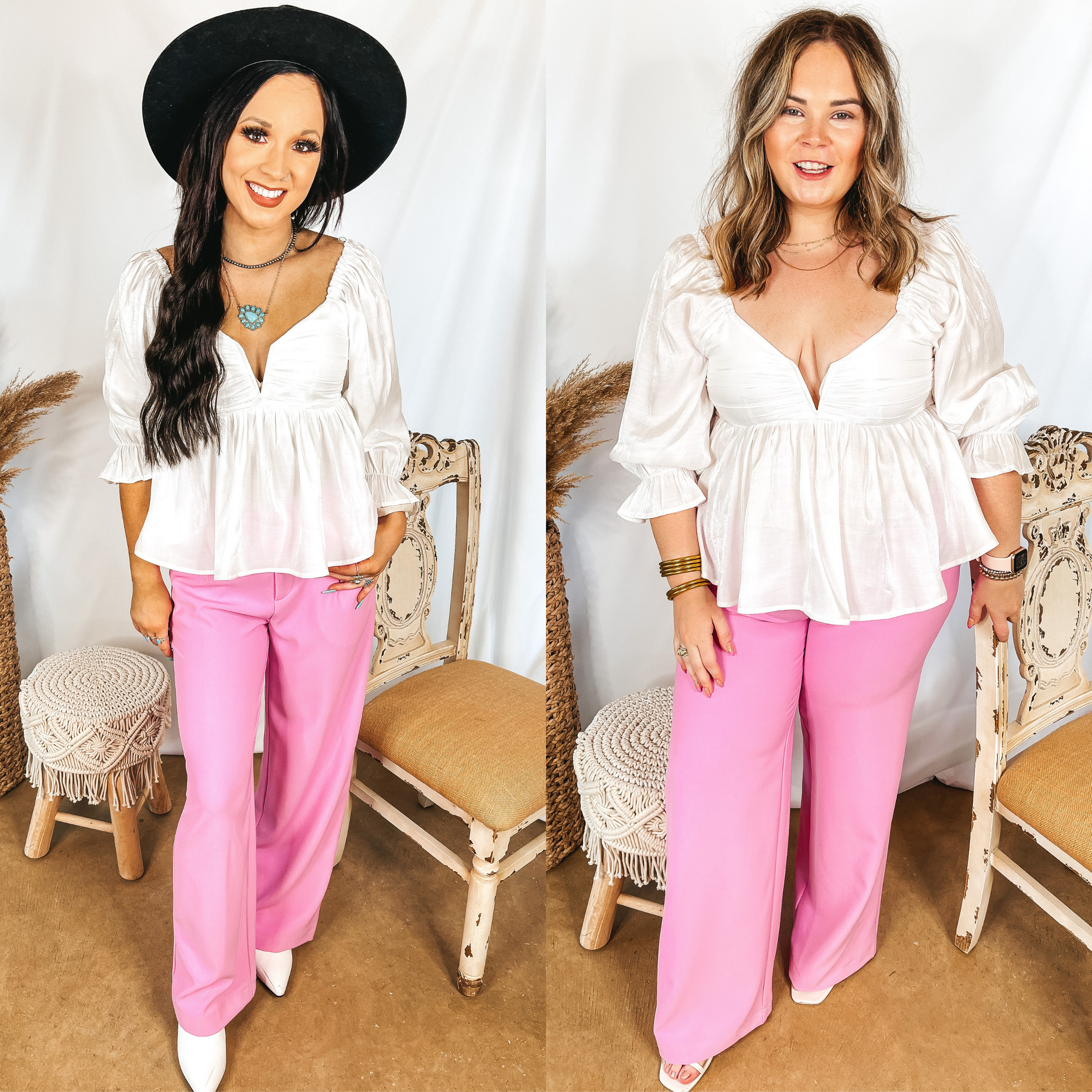 Models are wearing a white 3/4 sleeve blouse. Both models have it paired with pink wide leg trouser pants. Size small model has it paired with white booties and a black hat. Size large model has it paired with white strappy heels and gold jewelry.