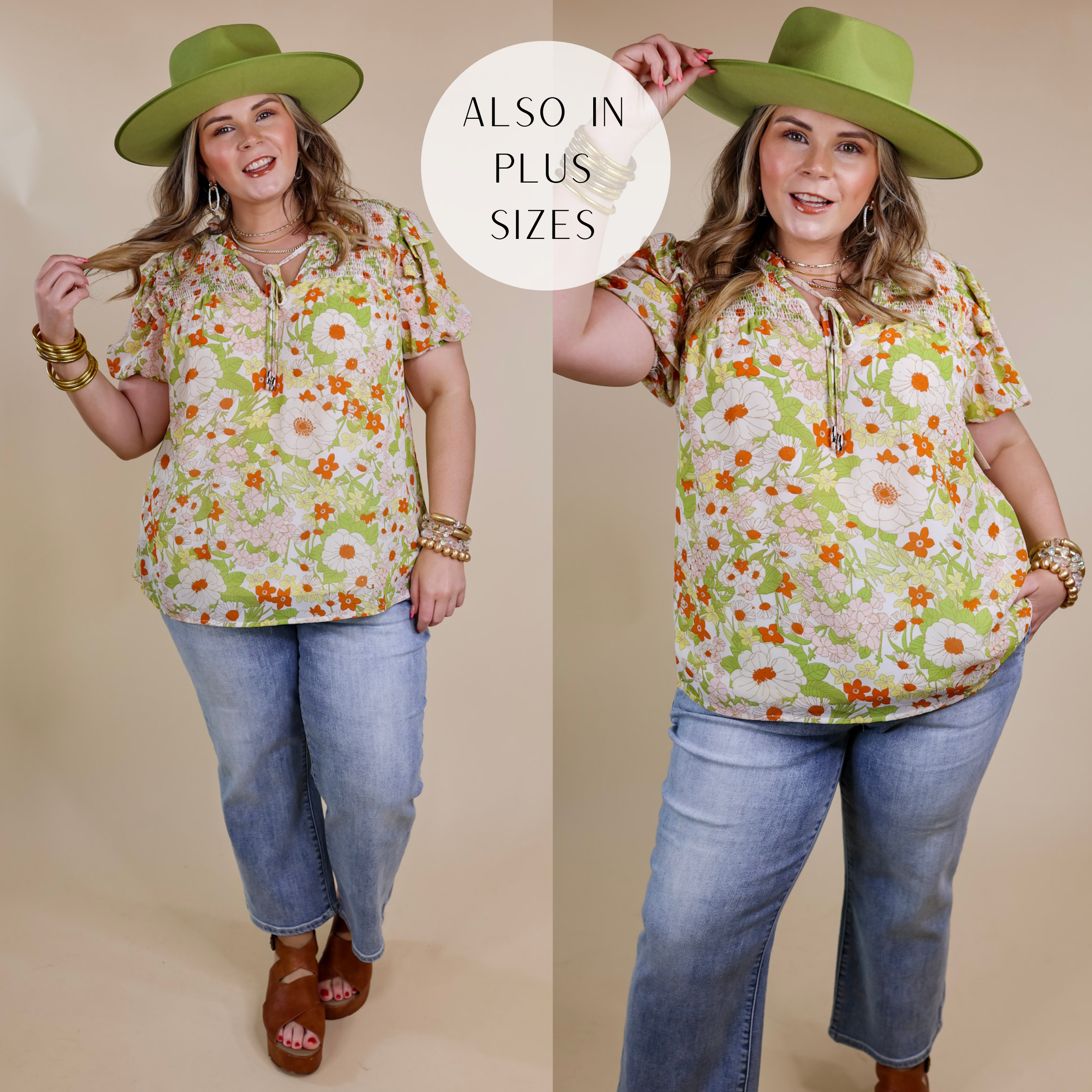 Model is wearing a green and orange floral top with a keyhole and short sleeves. Model has this top paired with light wash jeans, tan wedges, and gold jewelry.