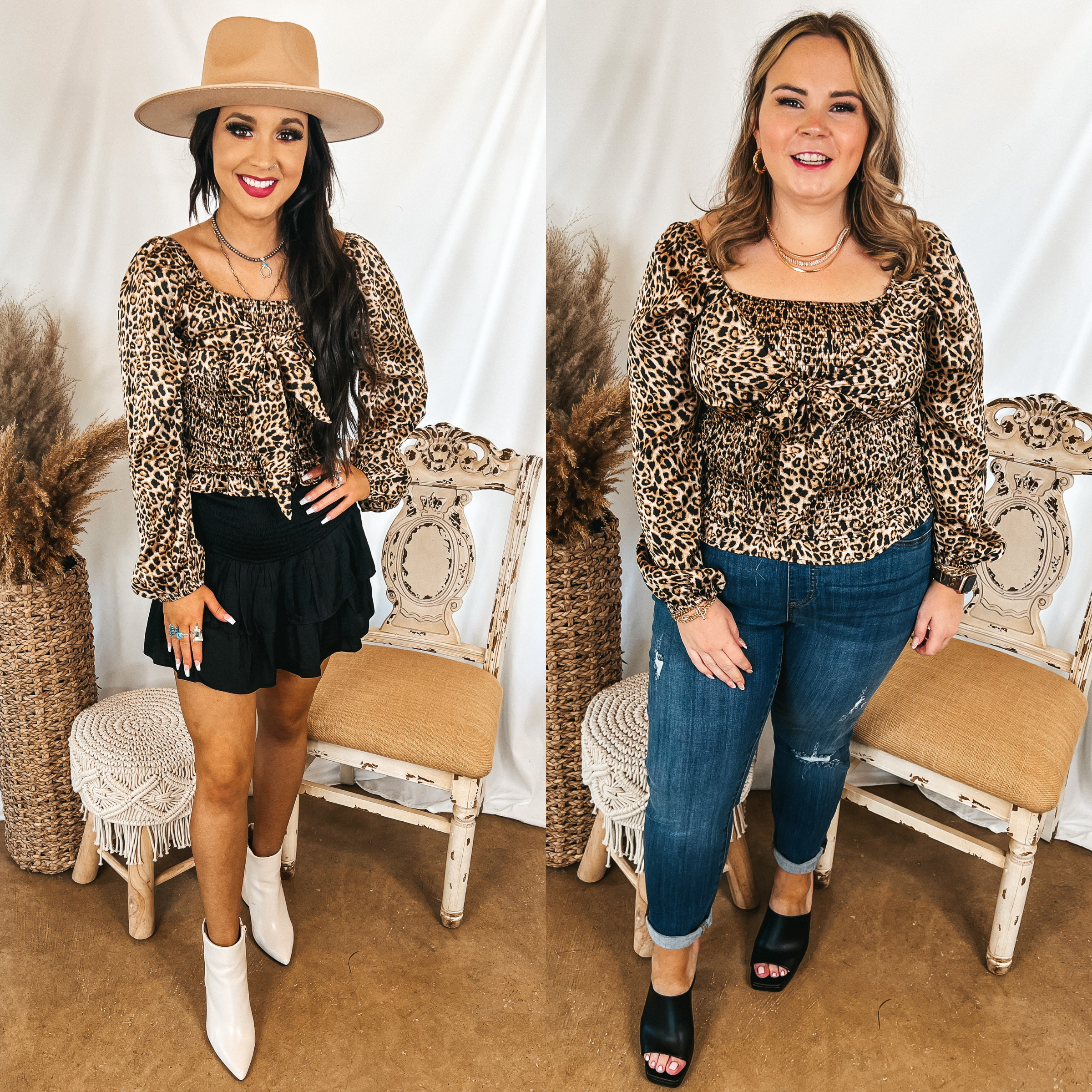 Models are wearing a leopard print satin top that has a smocked bodice with a tie across the front. Size small model has it paired with a black skirt, white booties, and a tan hat. Size large model has it paired  with skinny jeggings, black heels, and gold jewelry.