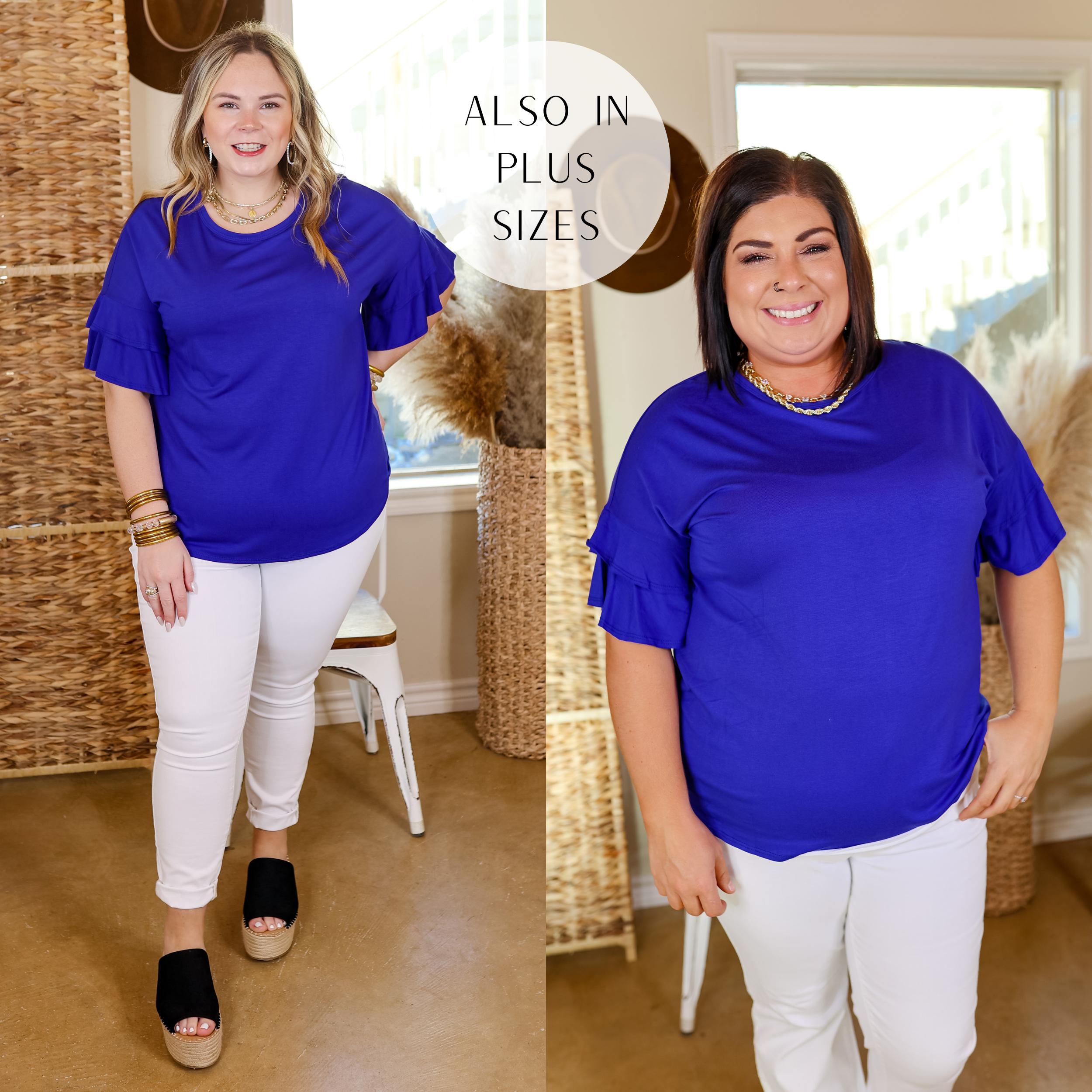Model is wearing a blue short sleeve shirt with ruffle detailing in royal blue. Model has this top paired with white jeans, black wedges, and gold jewelry. 