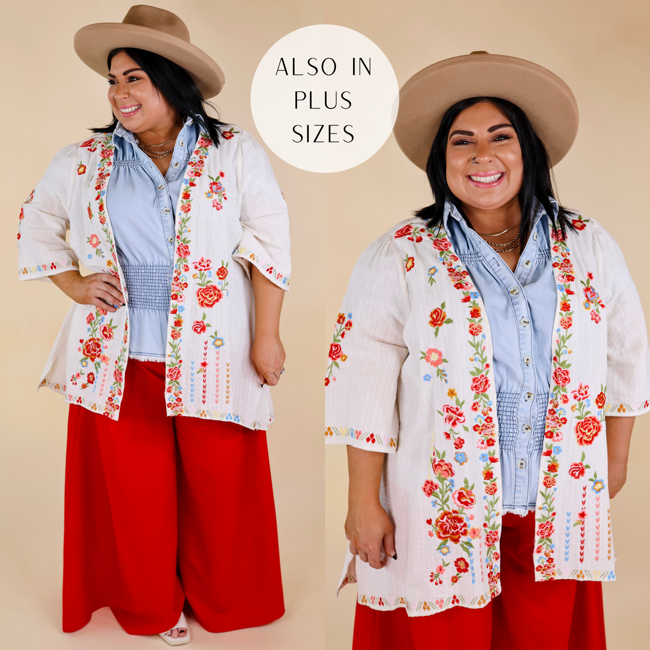 Model is wearing a floral embroidered ivory kimono with wide half sleeves. Model has this kimono on over a denim button up top, red pants, and a brown hat.