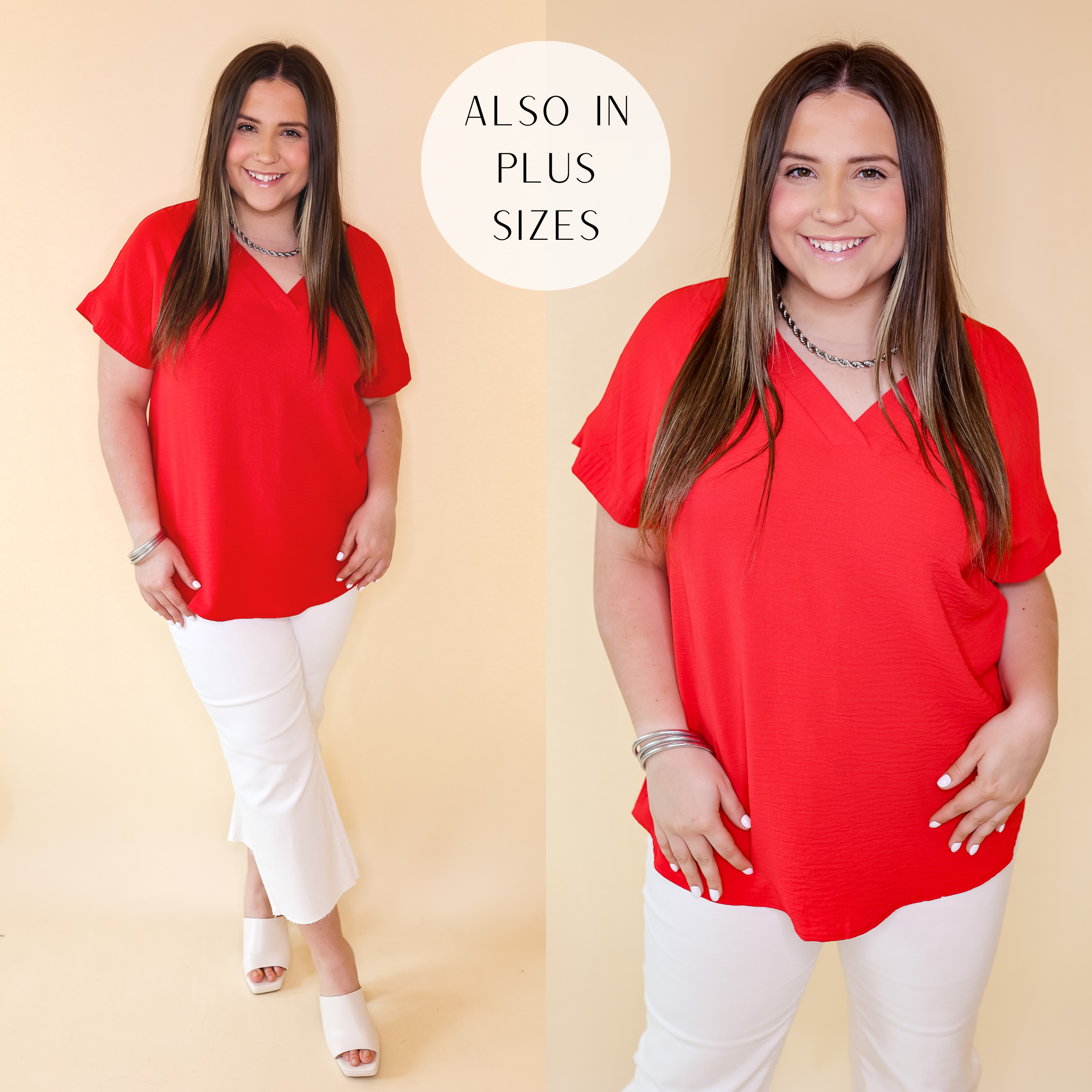 Model is wearing a v neck short sleeve top in red. Model has this top paired with white jeans, heels, and silver jewelry. Background is solid tan. 