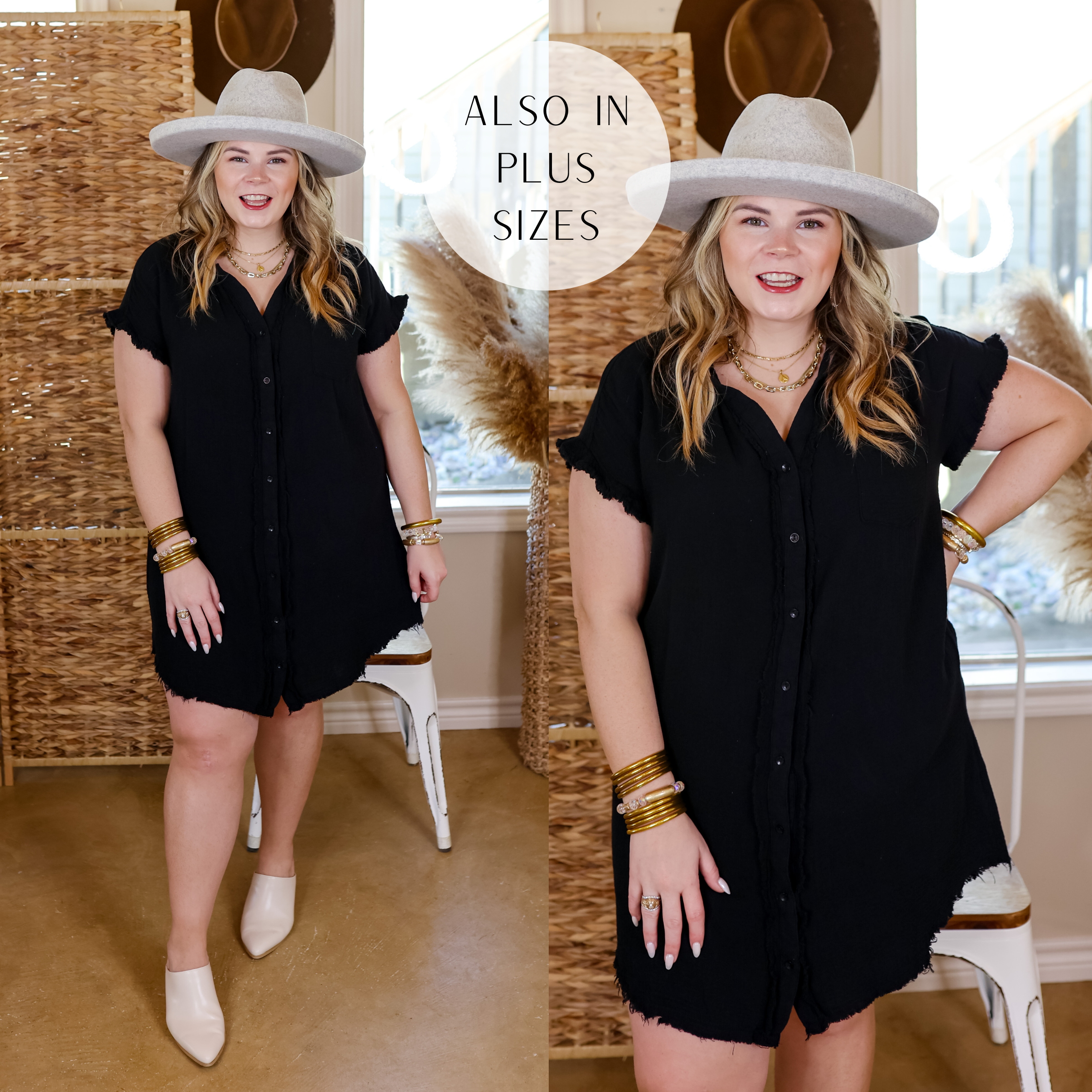Model is wearing a short button down dress with a raw hem in black. Model has this dress paired with ivory mules, an ivory hat, and gold jewelry. 