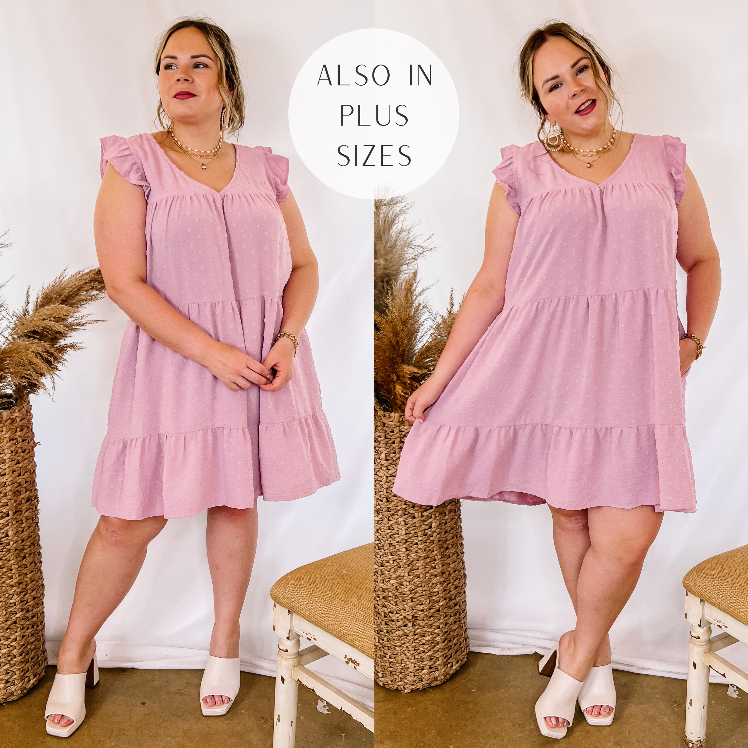 Model is wearing a swiss dot ruffle tiered dress with ruffle cap sleeves in mauve pink. Model has it paired with white heels and gold jewelry.