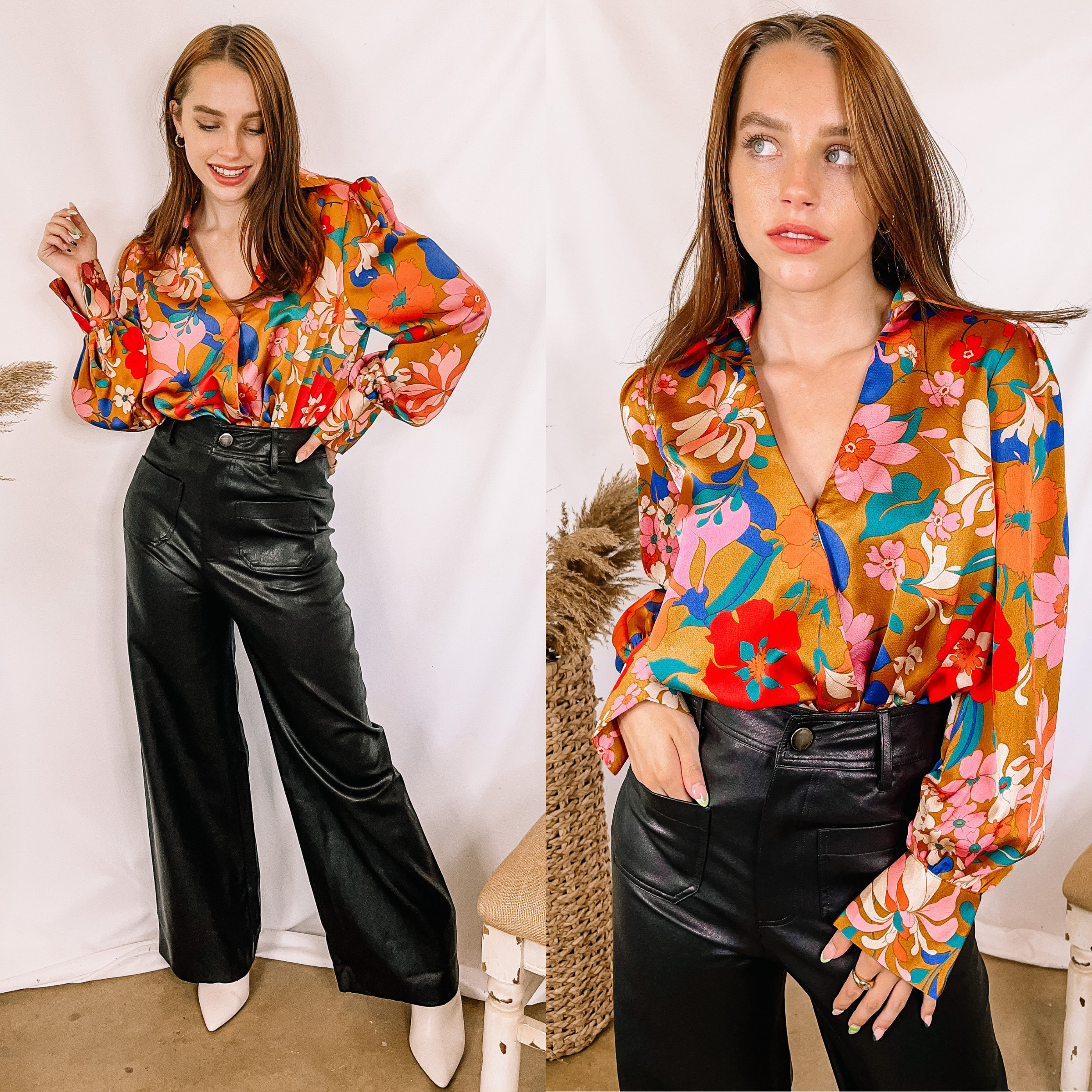 Model is wearing a gold floral print bodysuit with long sleeves and a collared neckline. Model has it paired with black faux leather pants, white booties, and gold jewelry.