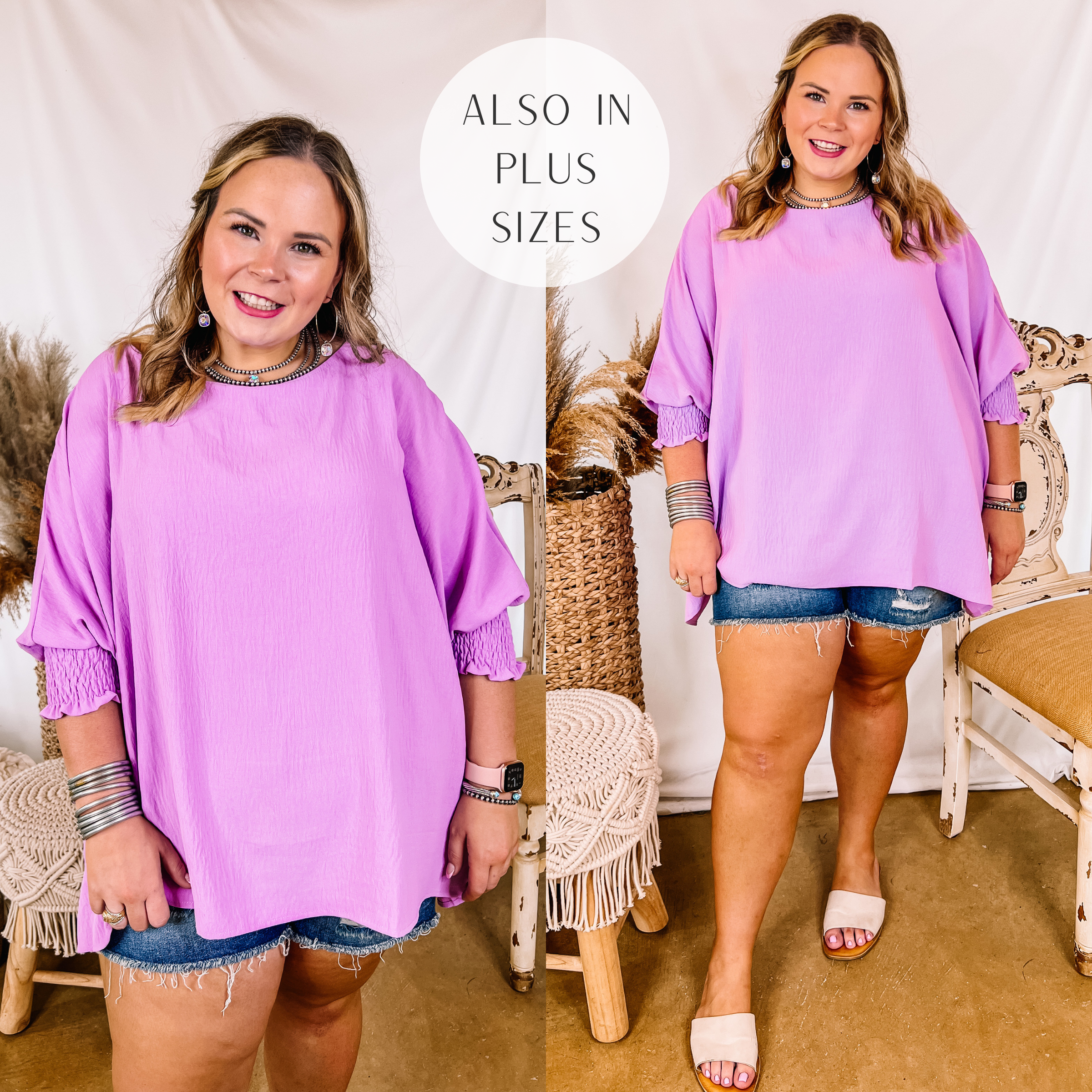 Model is wearing a purple oversized top with 3/4 sleeves. Model has this top paired with distressed denim shorts, white sandals, and silver jewelry.
