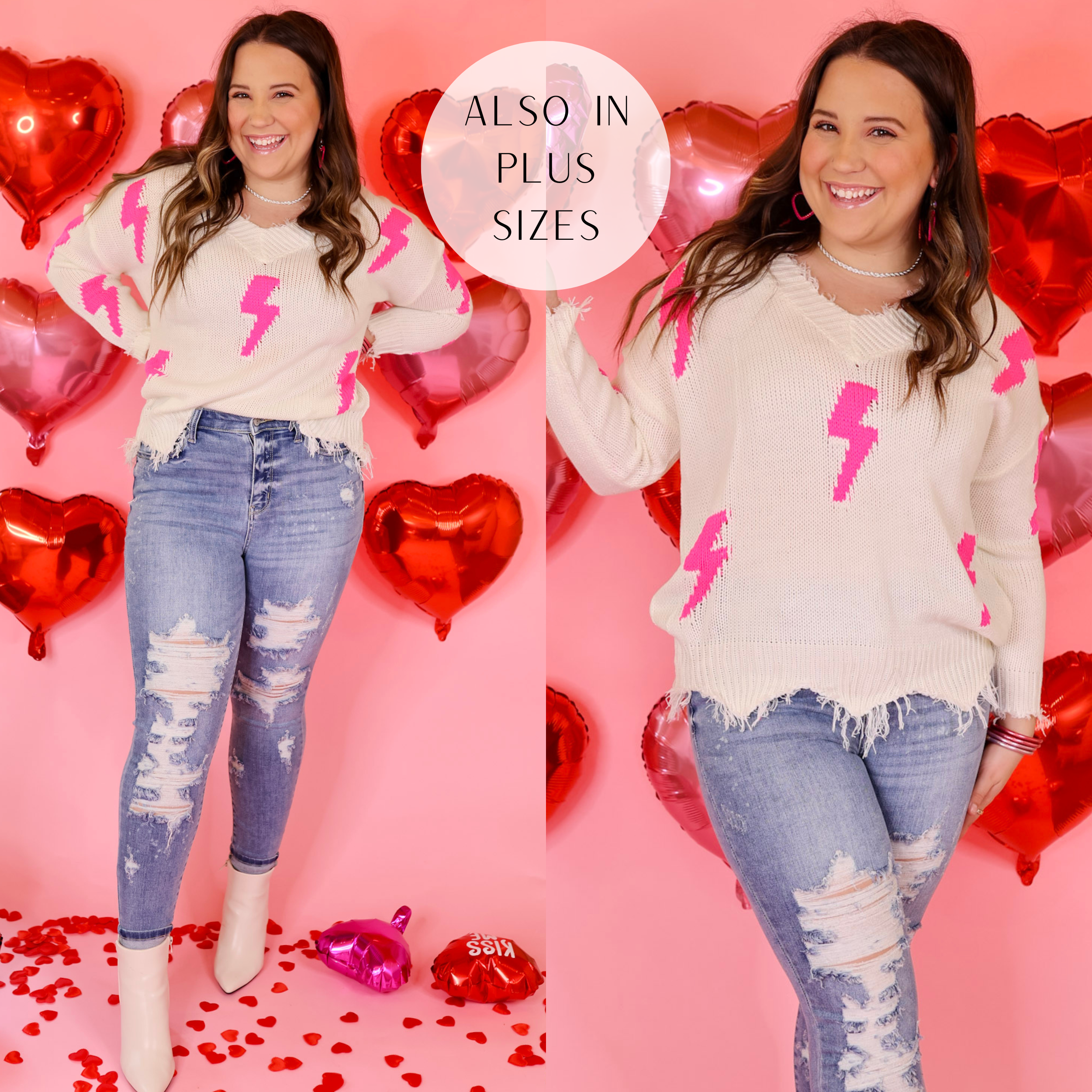Model is wearing a v neck ivory sweater with lightning bolts in hot pink. Model has this sweater paired with skinny jeans, white booties, and silver jewelry.  Backround is light pink with red heart balloons. 