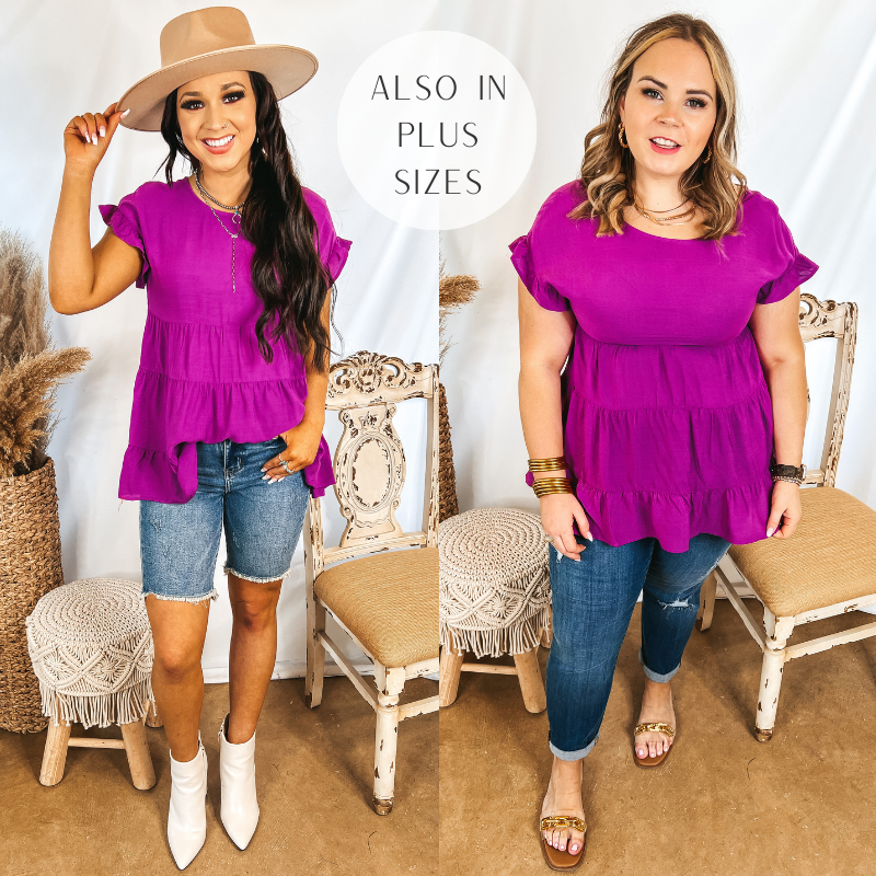 Models are wearing a purple ruffle tiered top. Size small model has it paired with bermuda shorts, white booties, and a tan hat. Size large model has it paired with distressed jeggings, gold sandals, and gold jewelry.