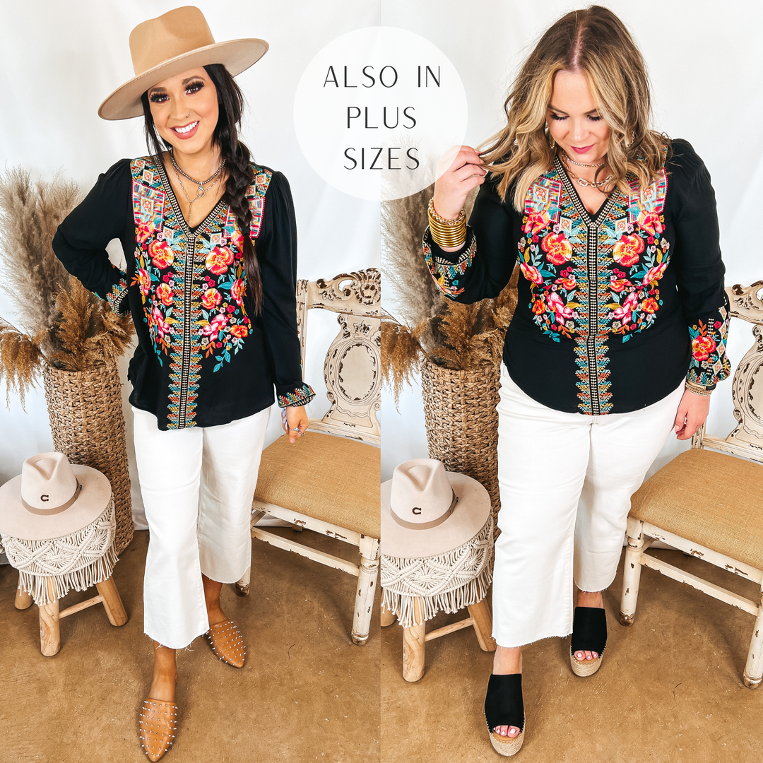 Models are wearing a black long sleeve top with embroidery on the front. Both models have it paired with white cropped jeans. Size small model has it paired with tan mules and a tan hat. SIze large model has it paired with black wedges and gold jewelry.