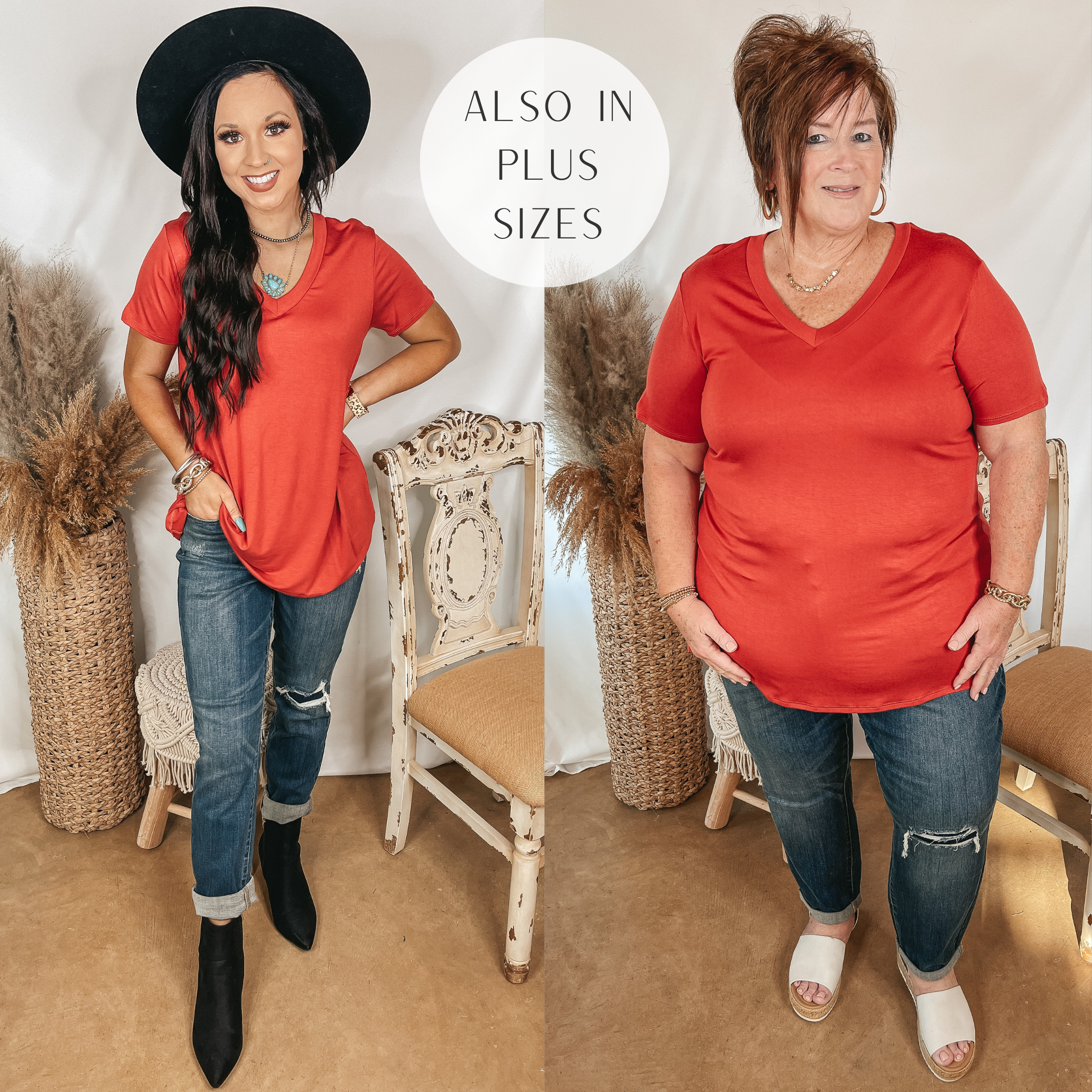 Models are wearing a orange-red v neck top. Both models have it paired with patch knee boyfriend jeans. Size small model has it paired with black booties and a black hat. Plus size model has it paired with White sandals and gold jewelry.