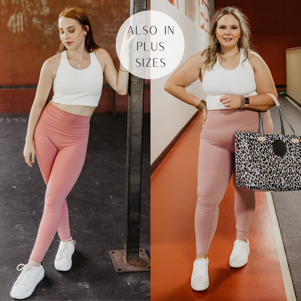 Models are wearing a white racer back sports bra. Size small model has it paired with mauve leggings and white sneakers, Size large model has it paired with white sneakers, dusty pink leggings, and a leopard print bag.