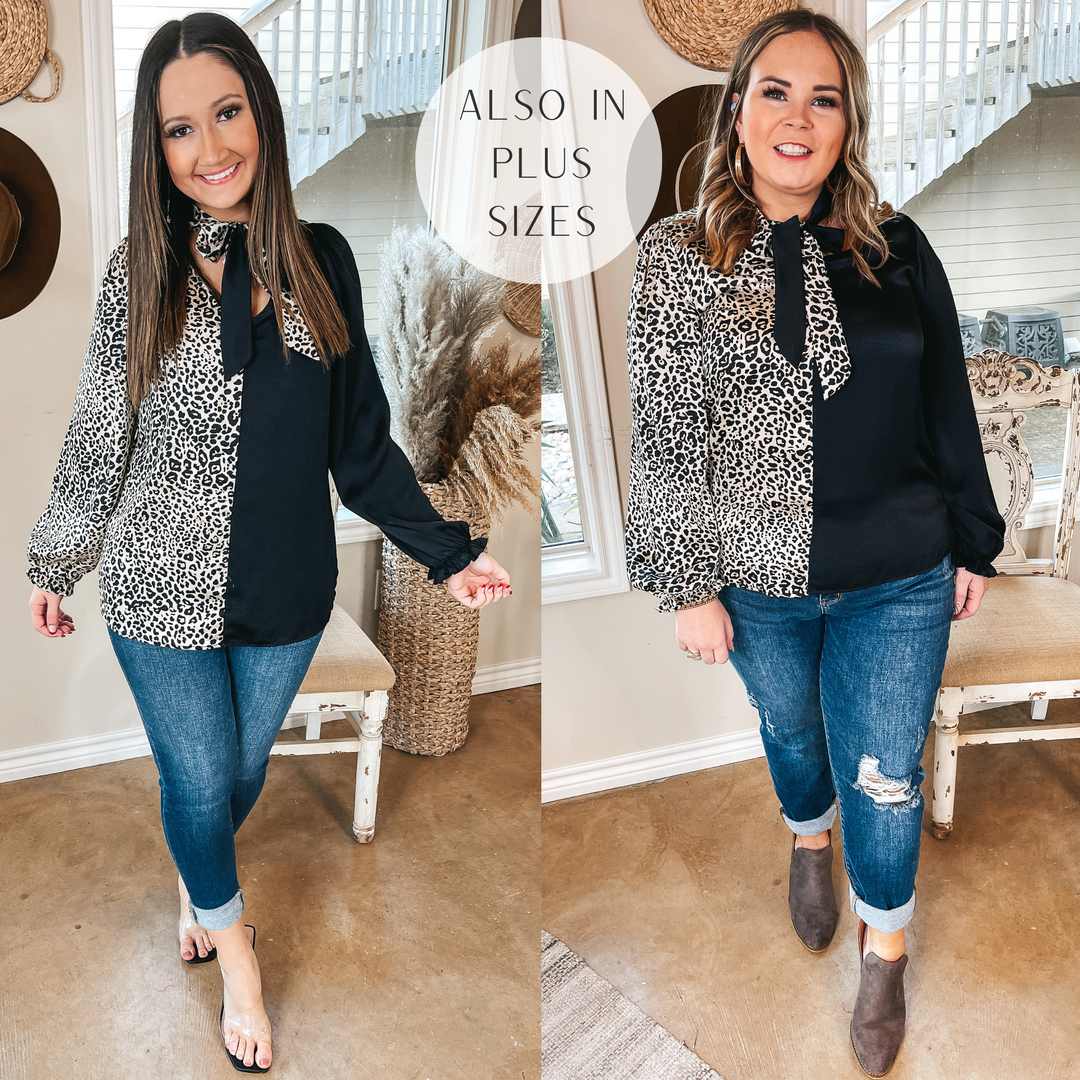 Models are wearing a blouse that is half solid black and half ivory leopard print. The blouse has a keyhole front with a tie neck. Size small model has it paired with black heels and gold jewelry. Size large model has it paired with taupe booties and gold jewelry.