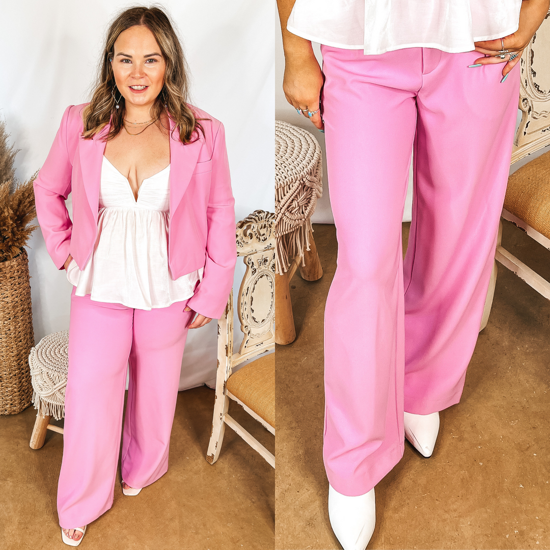 Models are wearing light pink trouser pants with pockets. Models have it paired with the matching blazer and a white blouse.