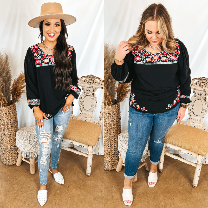 Models are wearing a black long sleeve top with floral embroidery detailing. Size small model has it paired with distressed light wash jeans, white mules, and a tan hat. Size large model has it paired with medium wash jeggings, white heels, and gold jewelry.