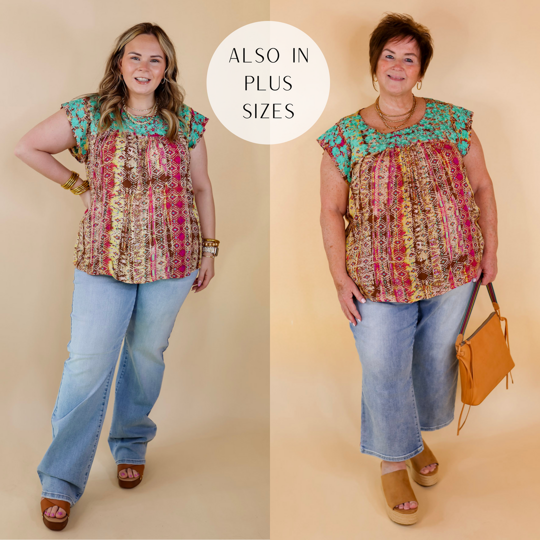 Model is wearing a tribal print blouse with ruffle cap sleeves and turquoise floral embroidery around the upper. Model has it paired with wide leg jeans, tan wedges, and gold jewelry.