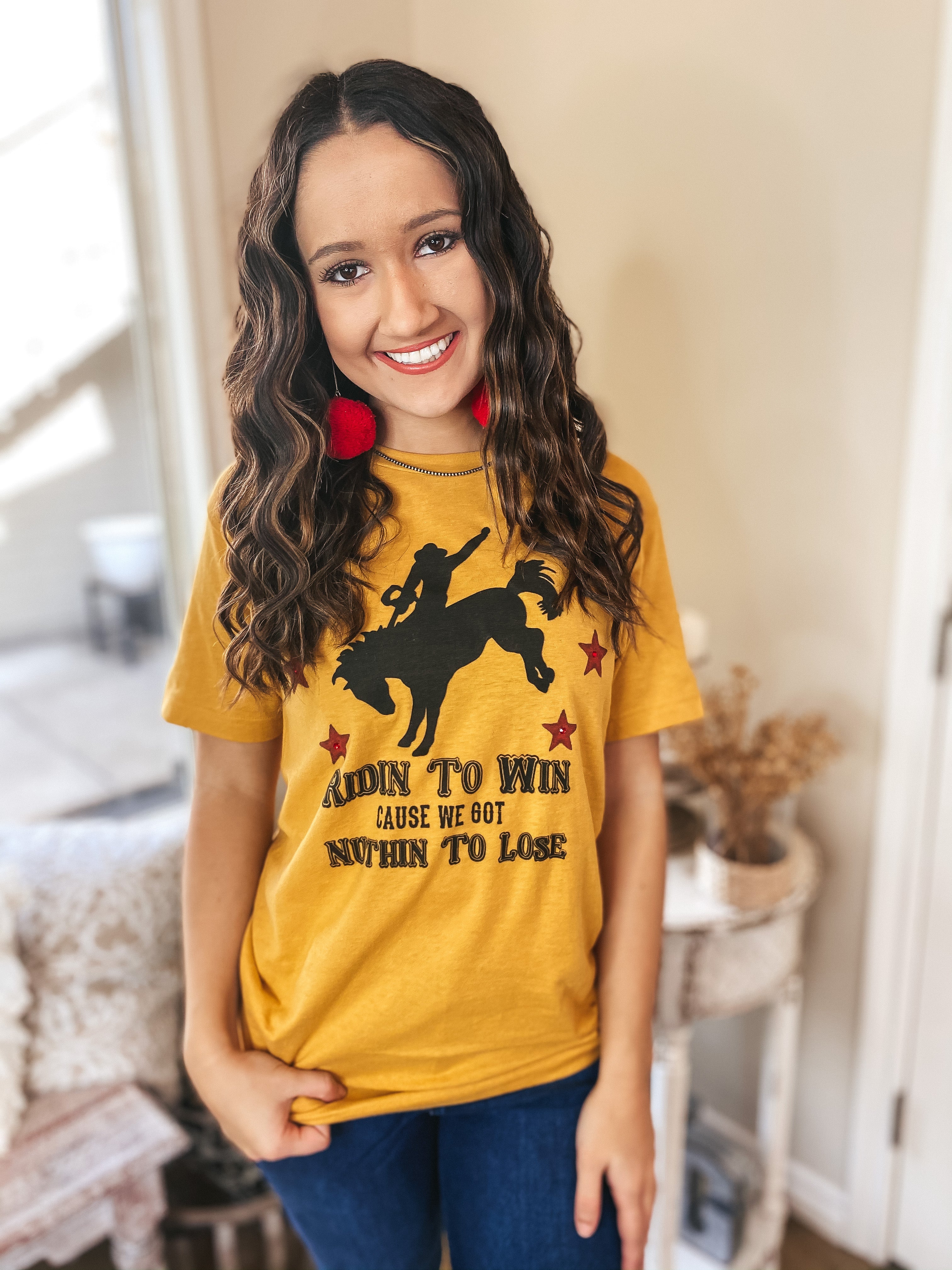 Ridin' To Win Bucking Horse Graphic Tee with Red Stars in Mustard Yellow - Giddy Up Glamour Boutique