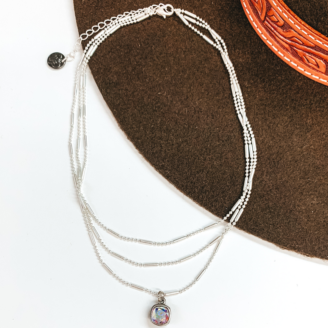 Pink Panache | Three Strand Silver Dot and Bar Chain Necklace with AB Cushion Cut Crystal Drop - Giddy Up Glamour Boutique