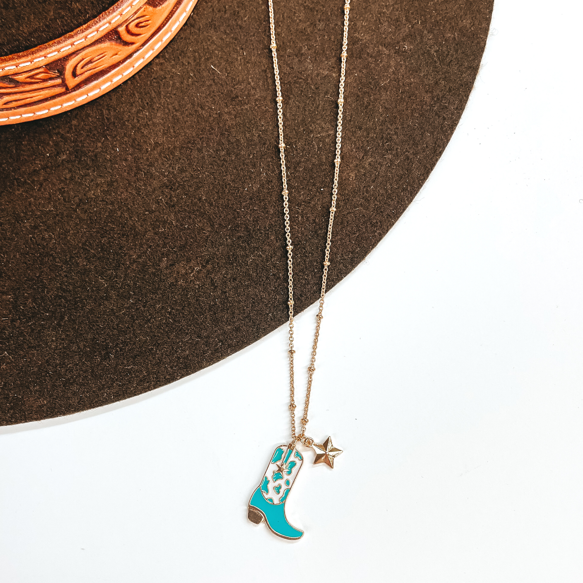Kick Your Boots Up Gold Necklace with Cow Print Boot Pendant in White and Turquoise - Giddy Up Glamour Boutique