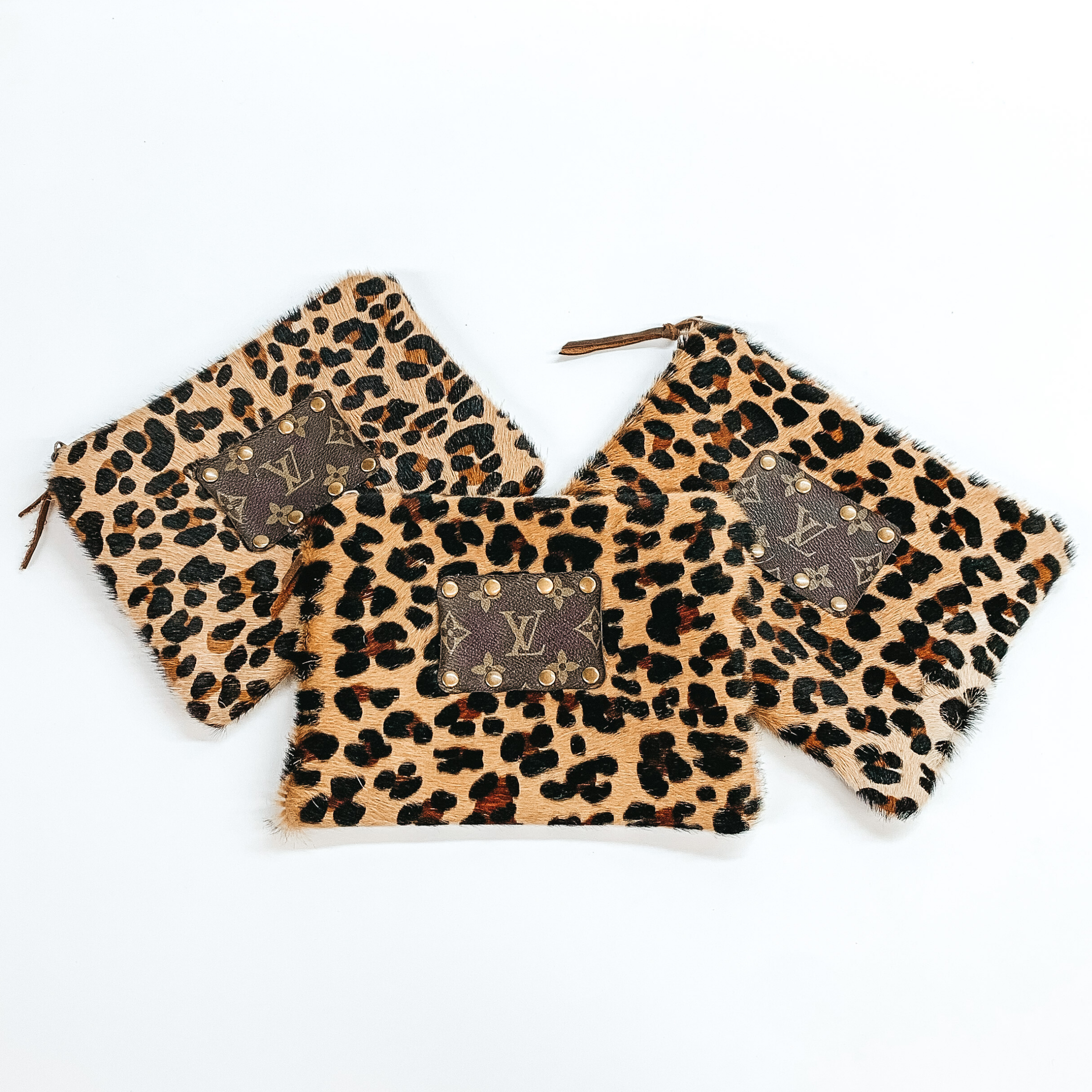 Keep It Gypsy | Leopard Print Cowhide Make Up Bag with a Leather Embellishment - Giddy Up Glamour Boutique
