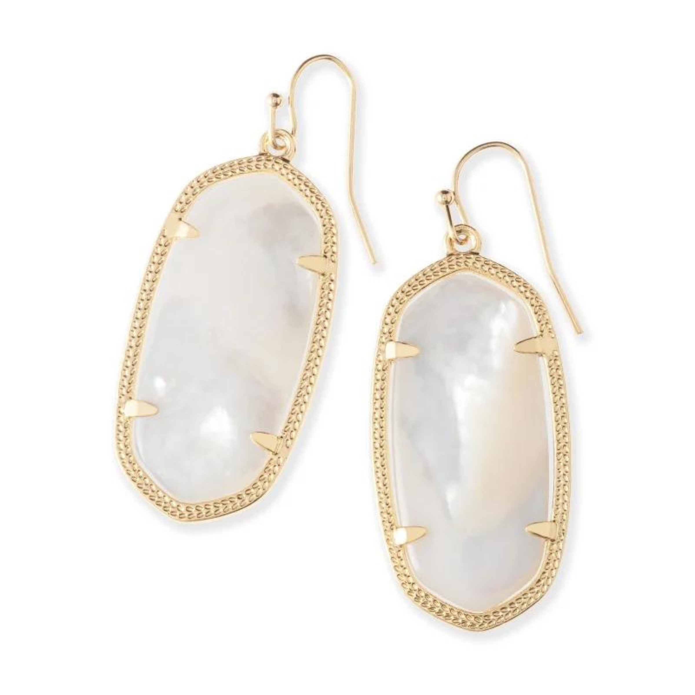 Gold drop dangle earrings with ivory pearl stone centers pictured on a white background.