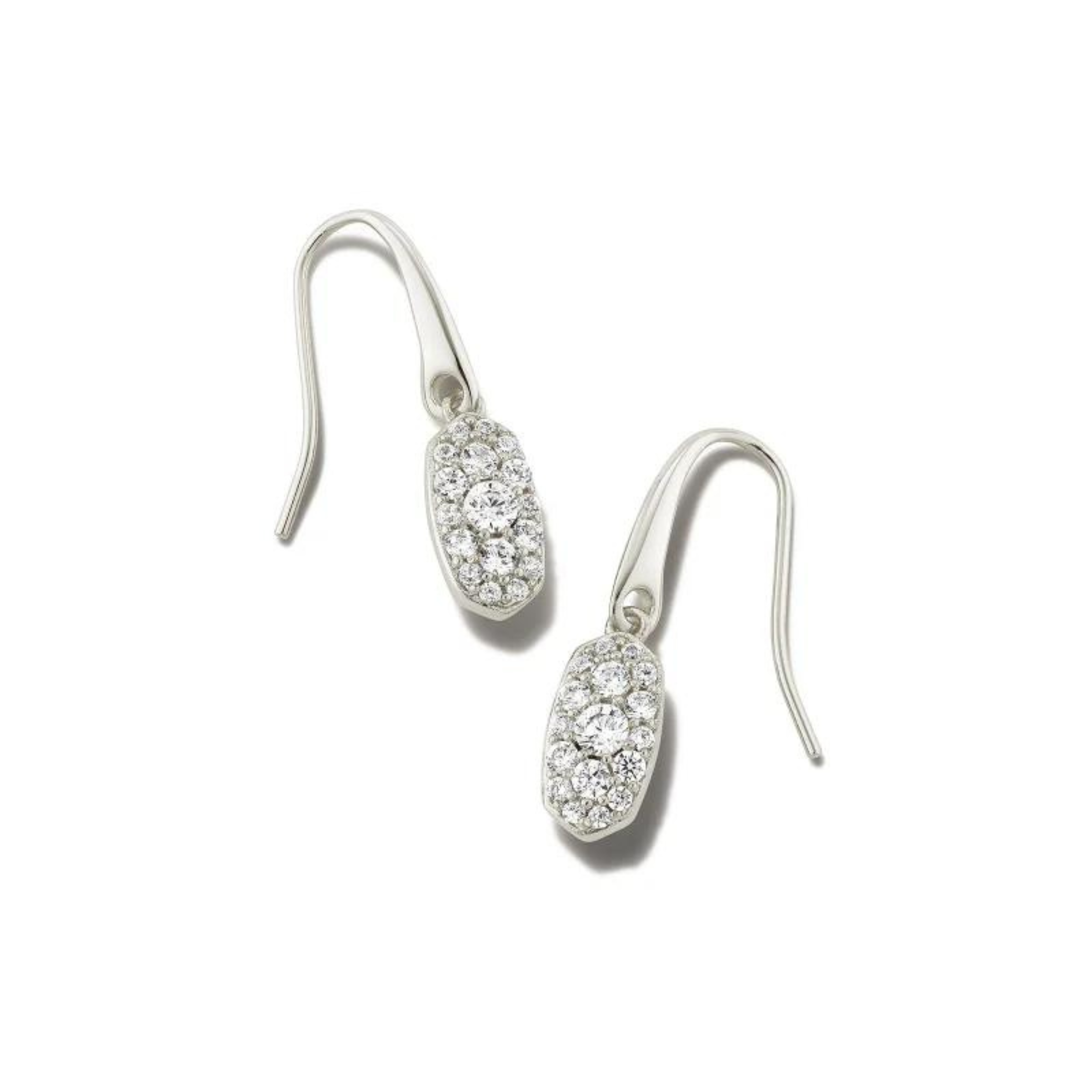 Silver, oval drop earrings with white crystals. These earrings are pictured on a white background. 