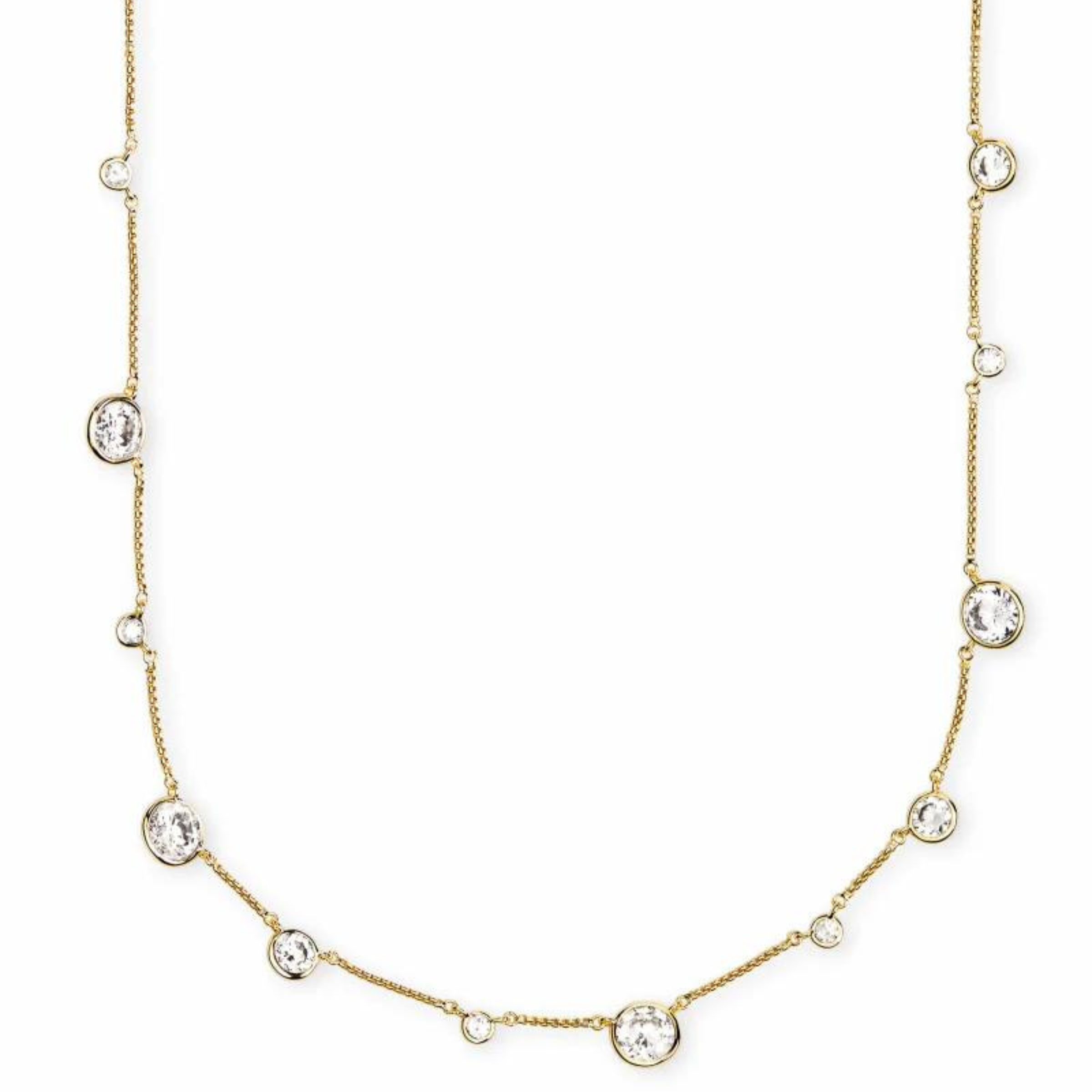 Gold necklace with different size clear crystals through out. This necklace is pictured on a white background. 
