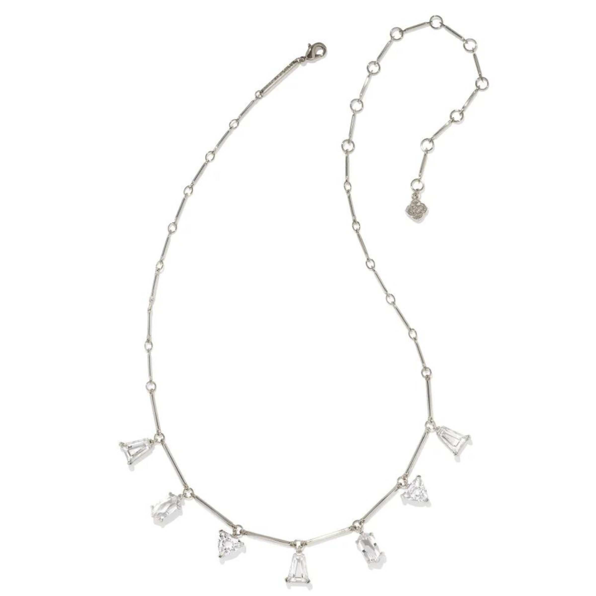 Silver chain necklace with white crystal charms in different shapes. This necklace is pictured on a white background.