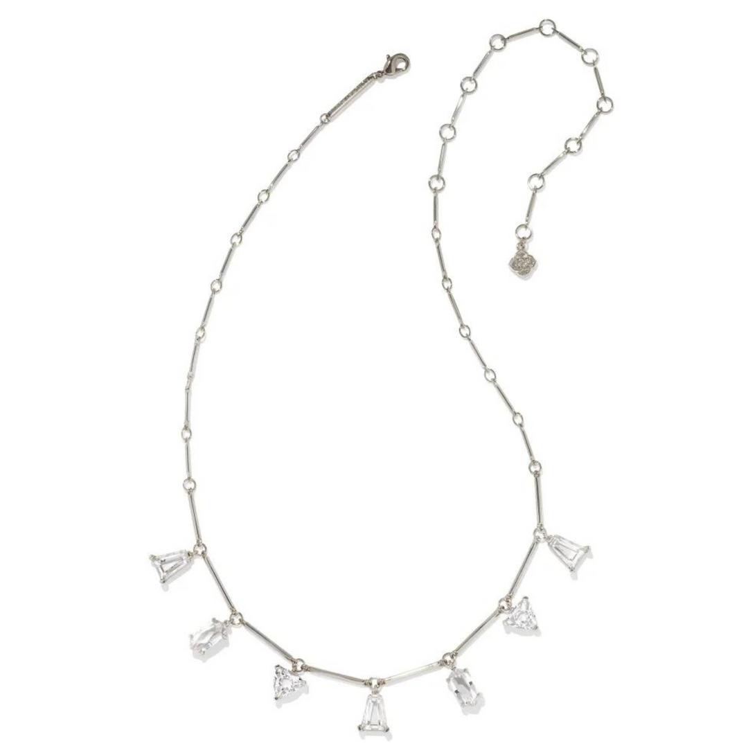 Silver chain necklace with white crystal charms in different shapes. This necklace is pictured on a white background.