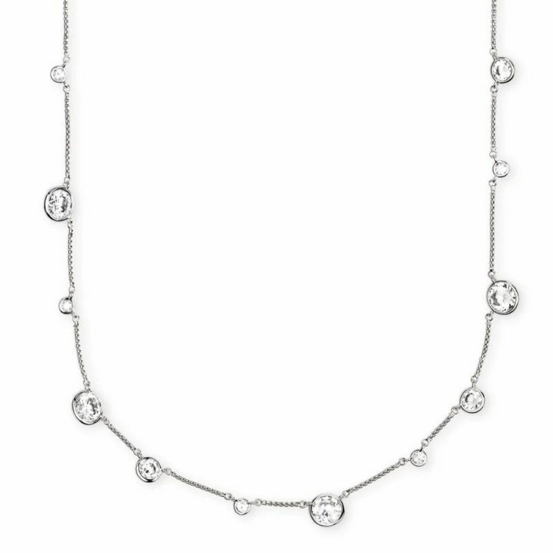 Silver chain necklace with white crystal charms in different shapes. This necklace is pictured on a white background.
