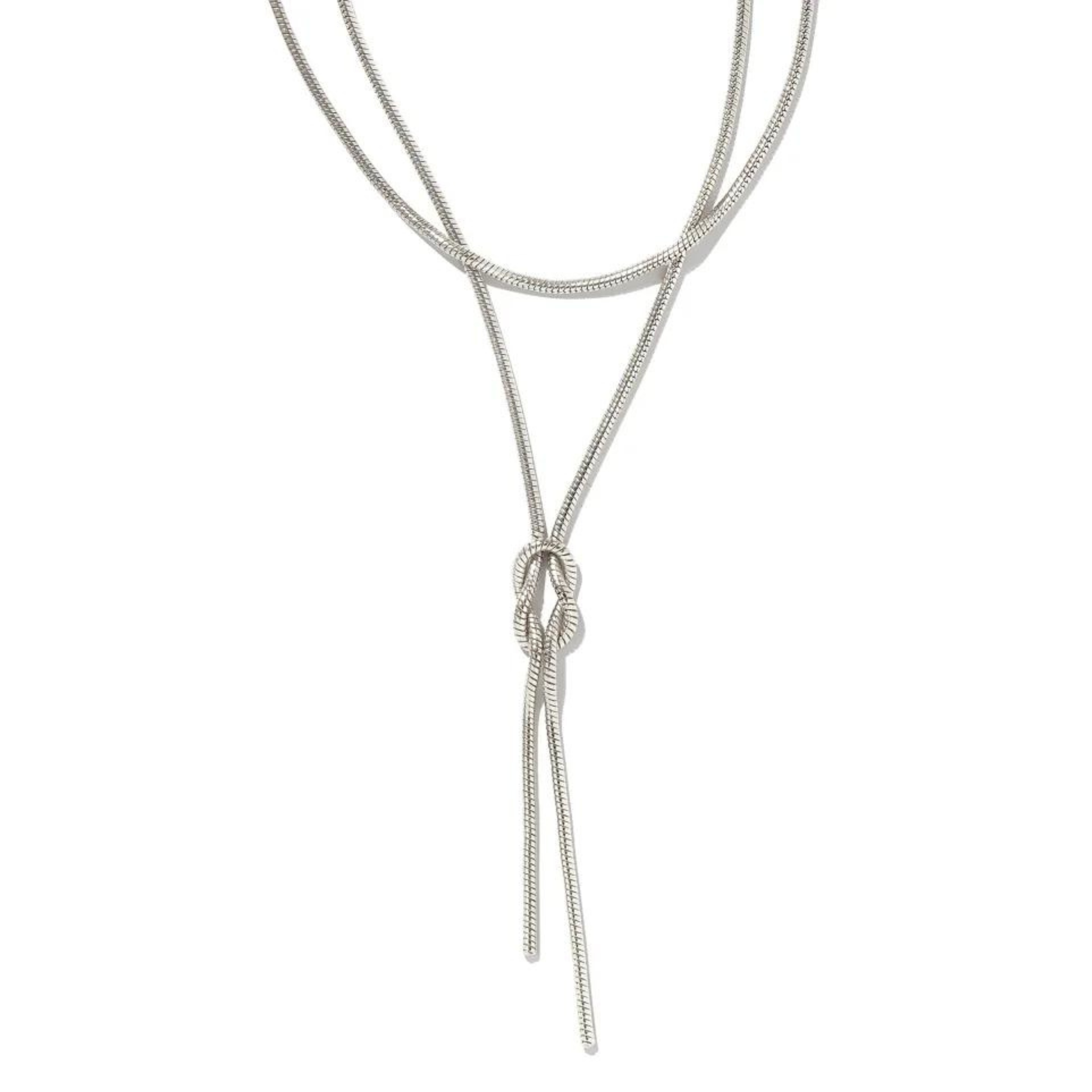 Silver necklace with two layers and has a tied knot towards the bottom. This necklace is pictured on a white background. 