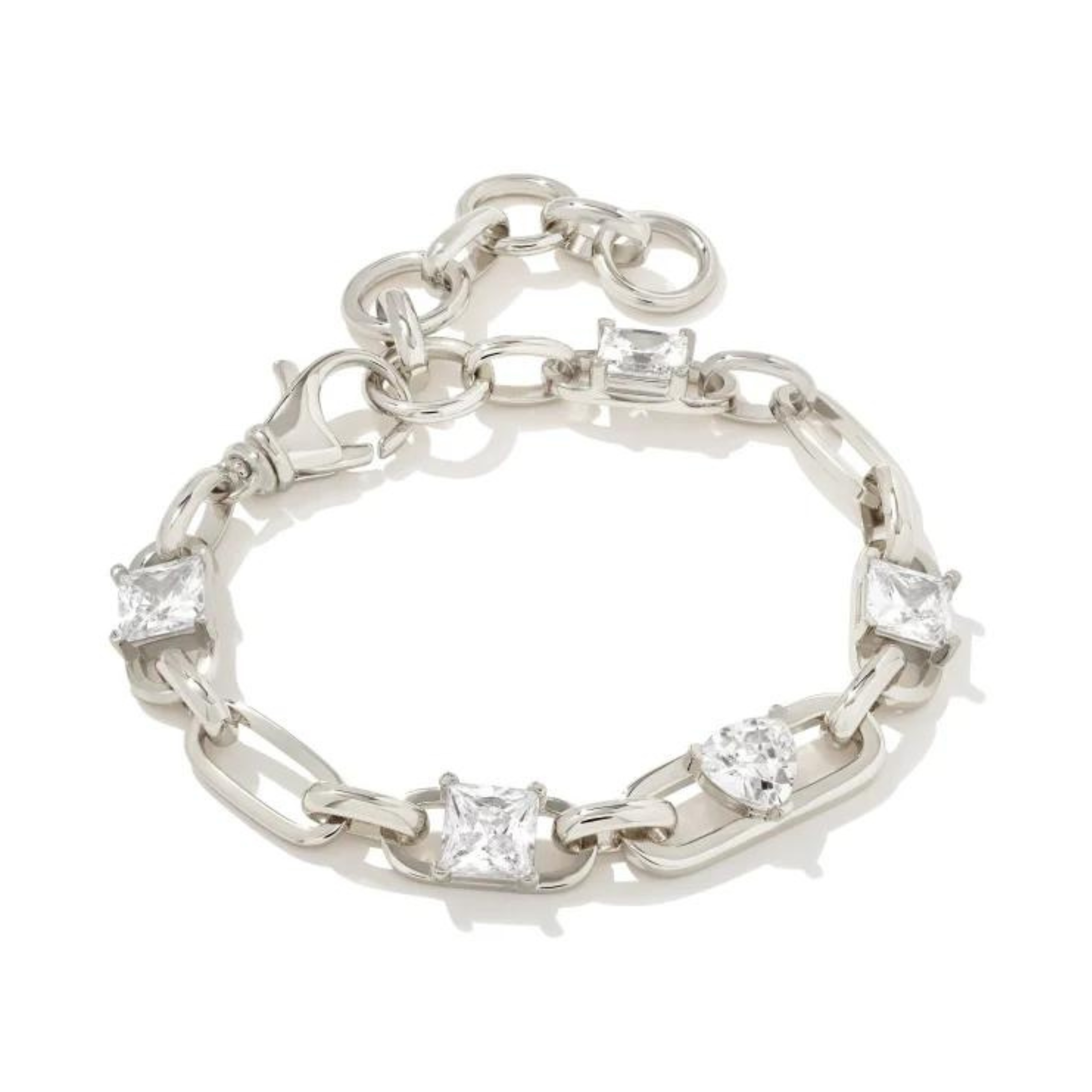 Silver chain bracelet with five clear crystals in different shapes. This bracelet is pictured on a white background. 