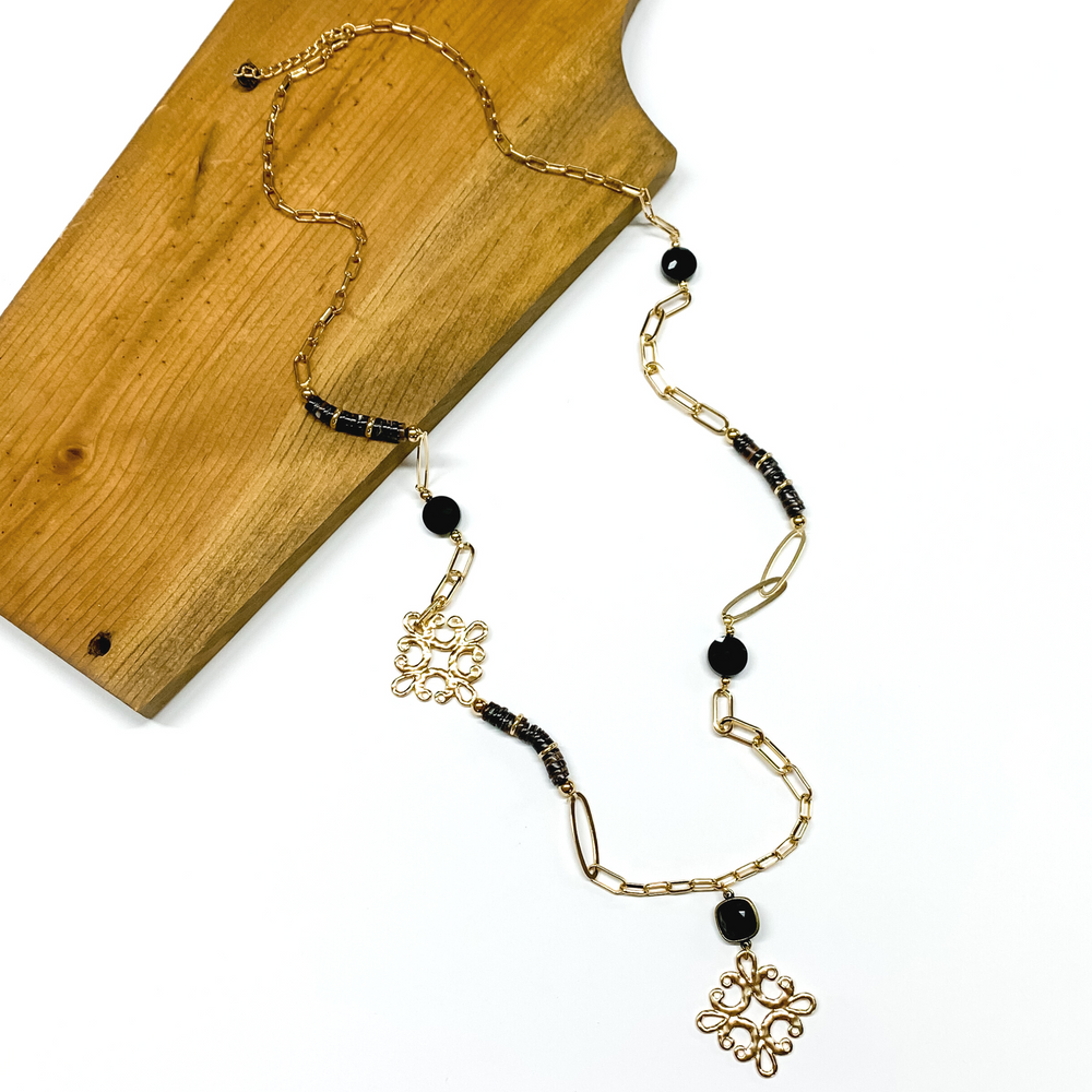 Pink Panache | Long Gold Tone Paperclip Chain and Black Beaded Necklace with Black Cushion Cut Crystal and Gold Tone Quatrefoil Drop - Giddy Up Glamour Boutique