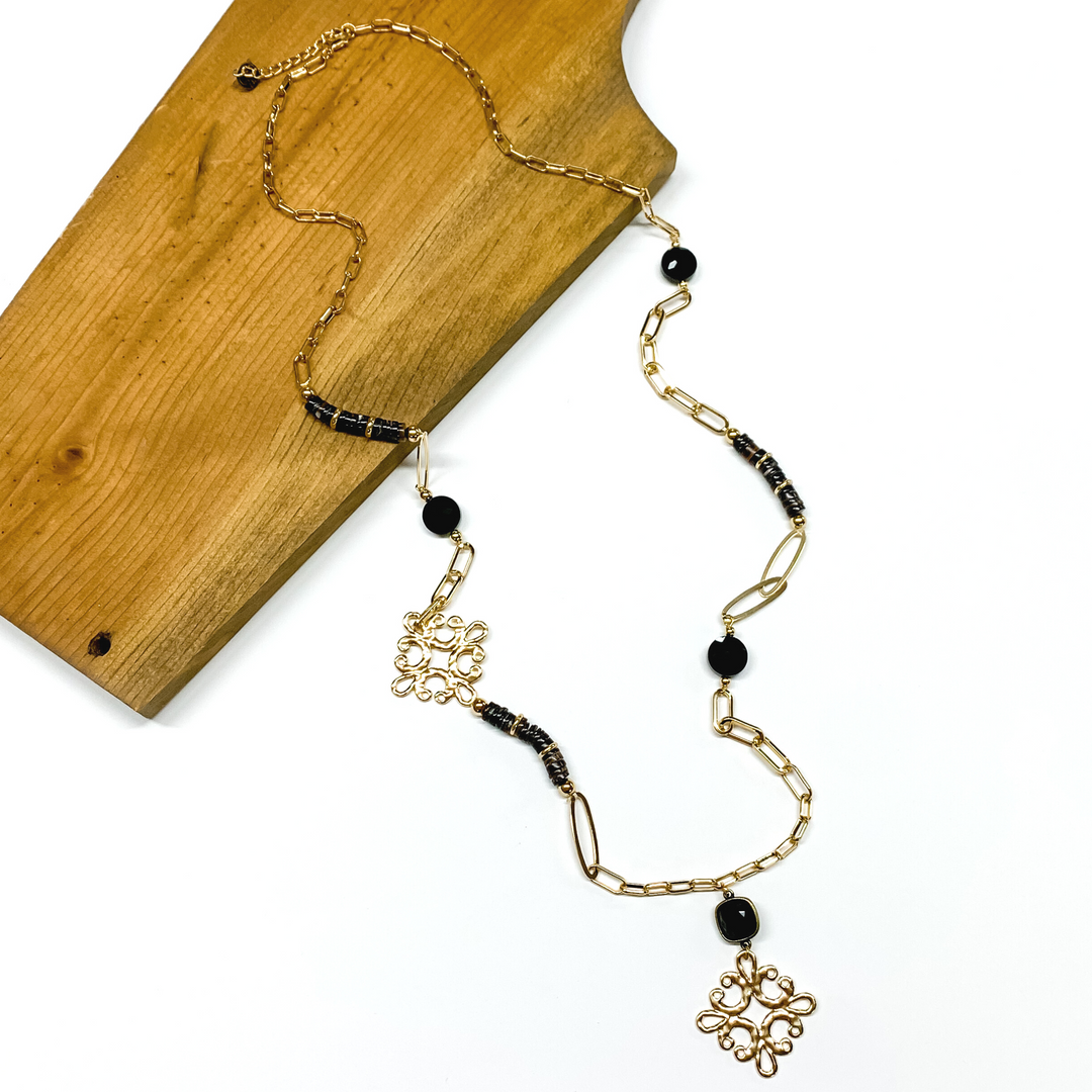 Pink Panache | Long Gold Tone Paperclip Chain and Black Beaded Necklace with Black Cushion Cut Crystal and Gold Tone Quatrefoil Drop - Giddy Up Glamour Boutique