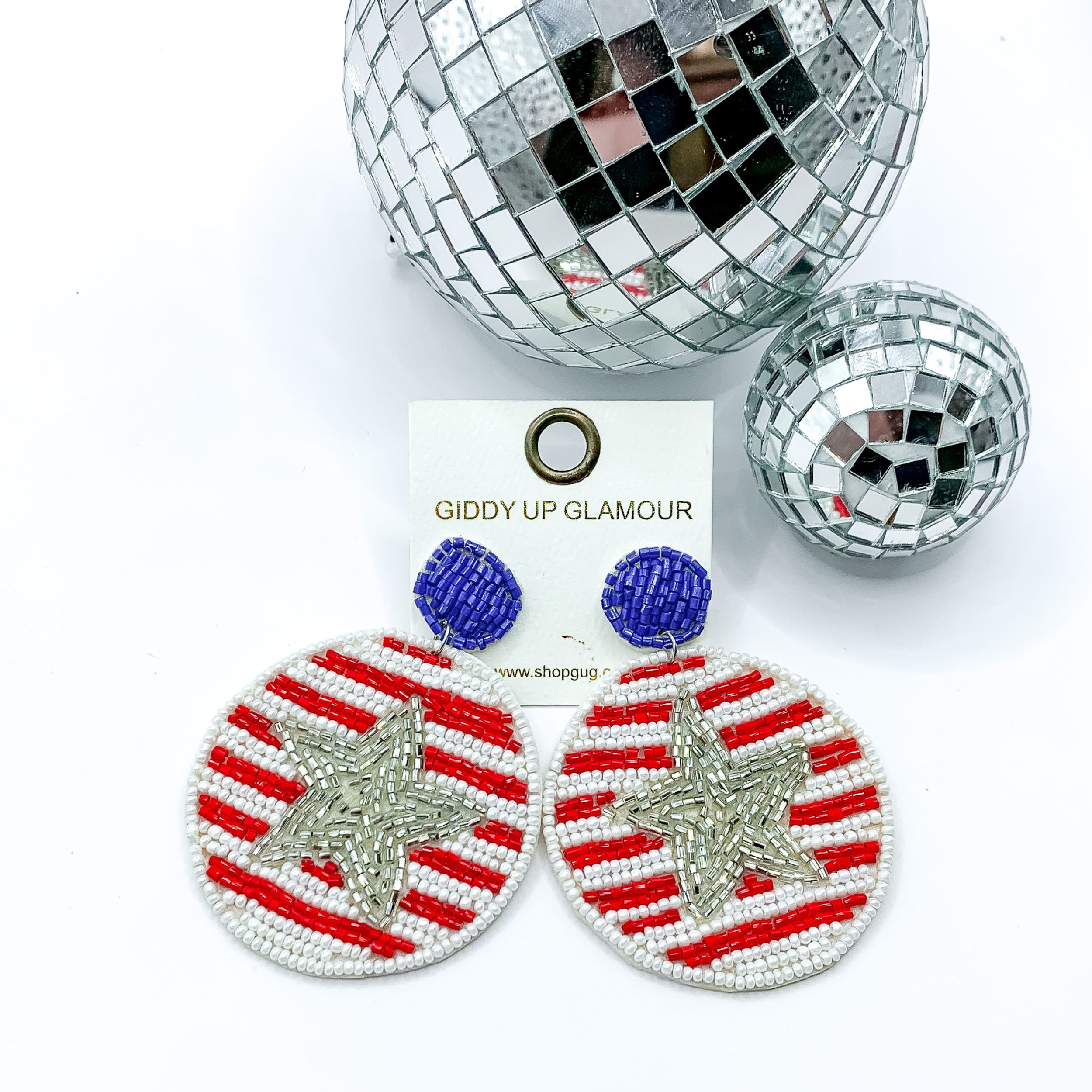 USA Strong Beaded Circle Drop Earrings with Silver Center Star, pitured with silver disco balls on a white background.