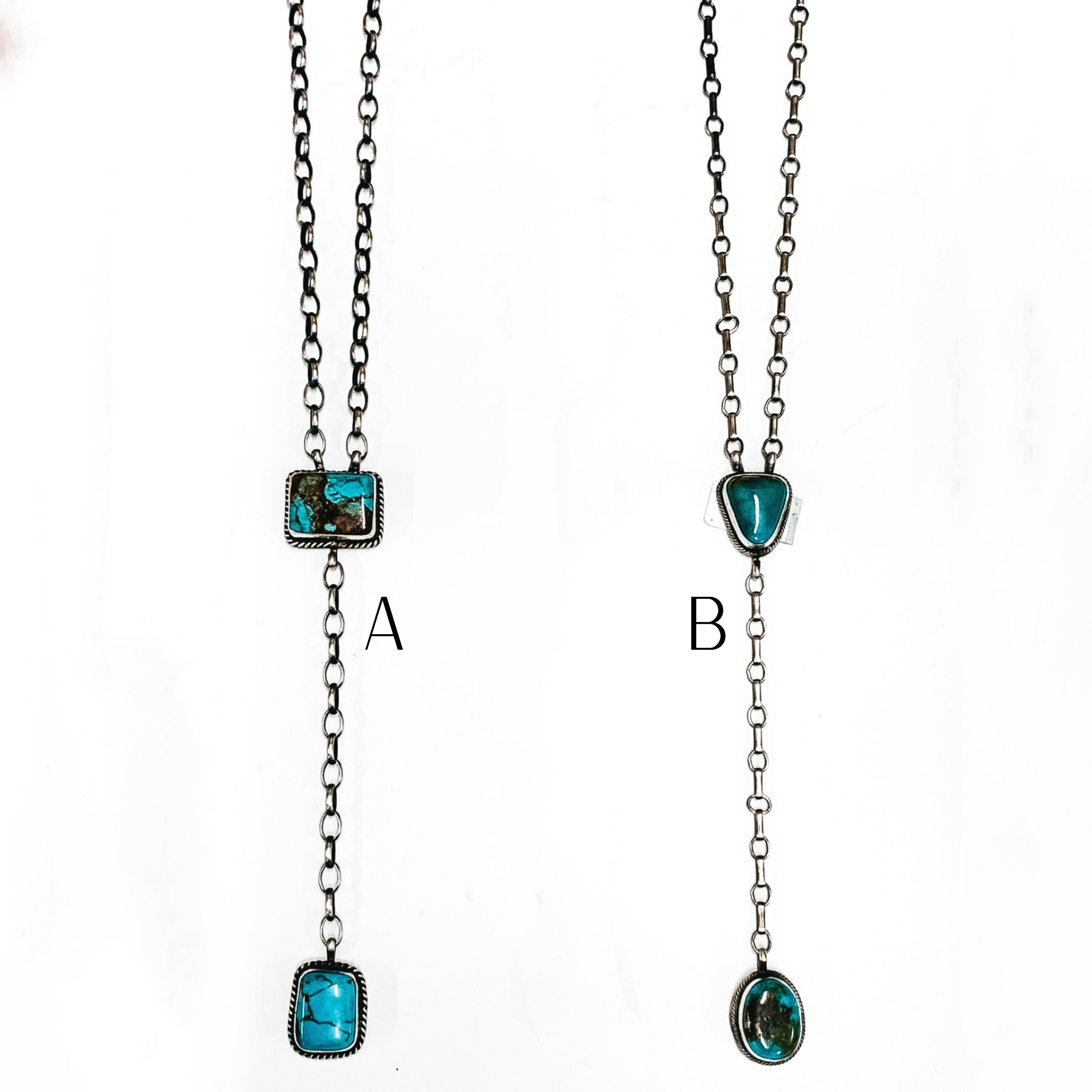 Two silver chain lariat necklace with two turquoise stones. This necklace is pictured on a white background. 