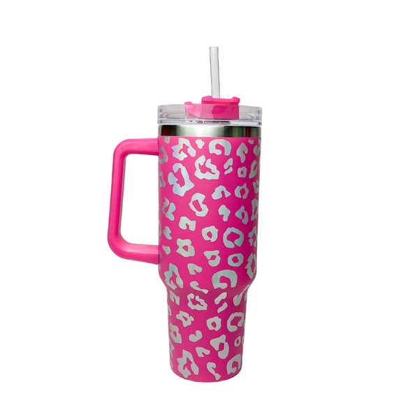 Pictured is a hot pink tumbler with a handle, clear straw, and an iridescent leopard print design. This tumbler is pictured on a white background.