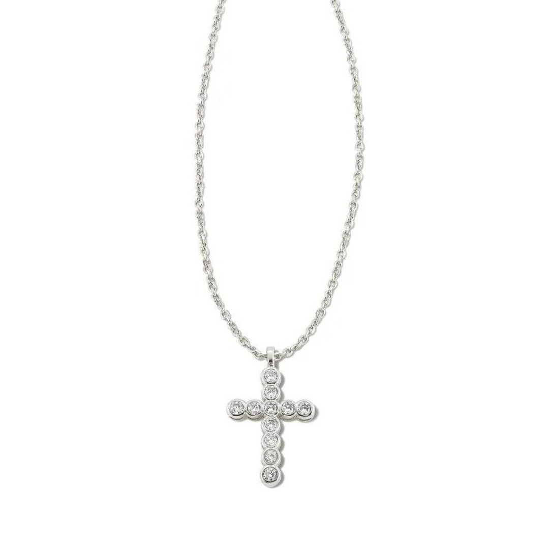 Silver necklace with white crystal cross pendant, pictured on a white background.