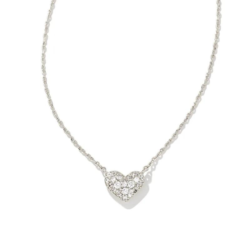Silver crystal heart necklace pictured on a white bacground.