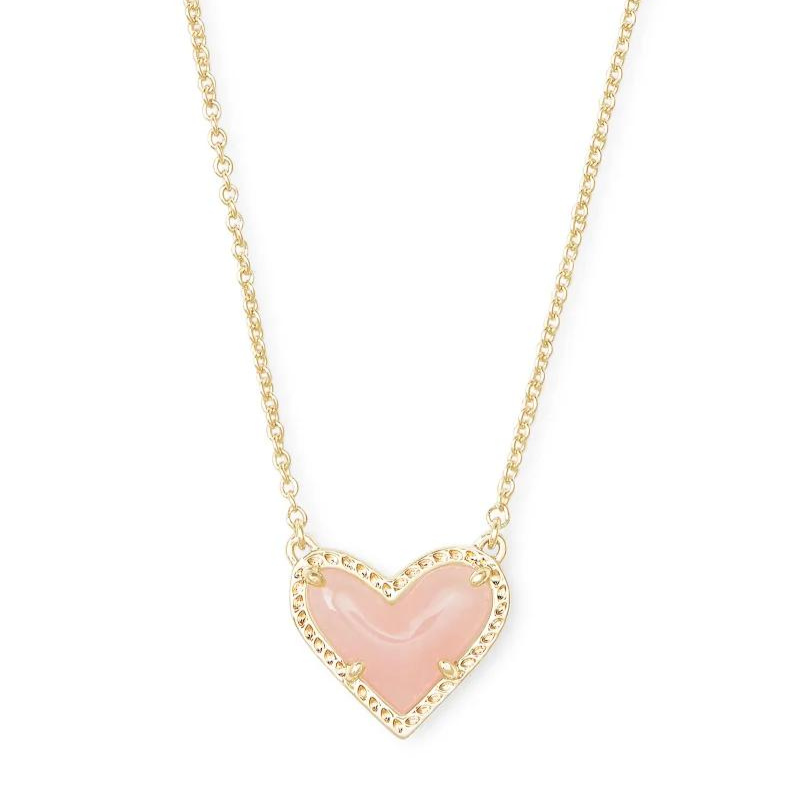 Gold heart necklace with rose quartz stone, pictured on a white background.