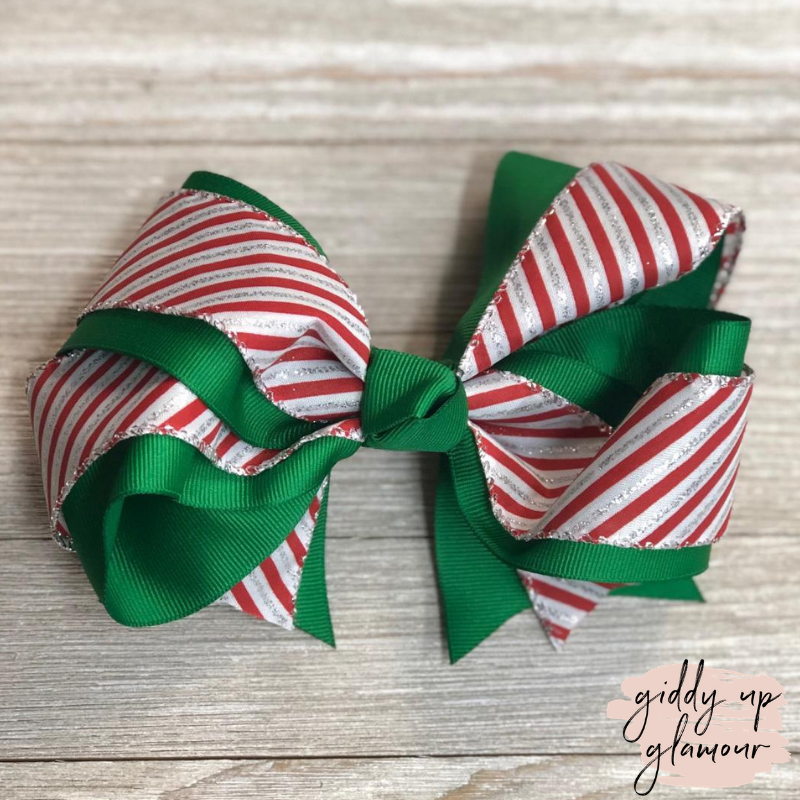 Candy Cane Stripe Hair Bow with Glitter and Green Accents - Giddy Up Glamour Boutique