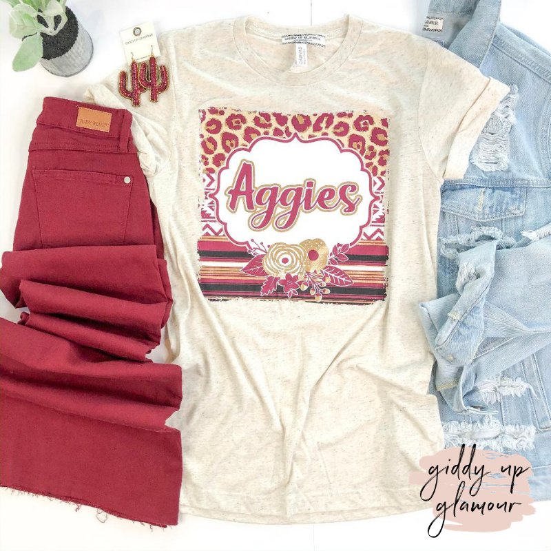 Last Chance Size 3XL | Aggie Game Day | Cheetah & Serape with Aggies in Cursive Short Sleeve Tee Shirt in Oatmeal Ivory - Giddy Up Glamour Boutique