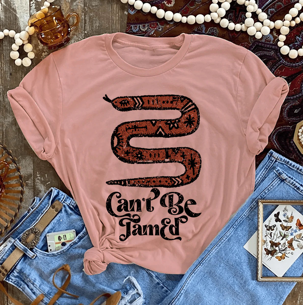 Online Exclusive | Can't Be Tamed Graphic Tee in Desert Rose - Giddy Up Glamour Boutique