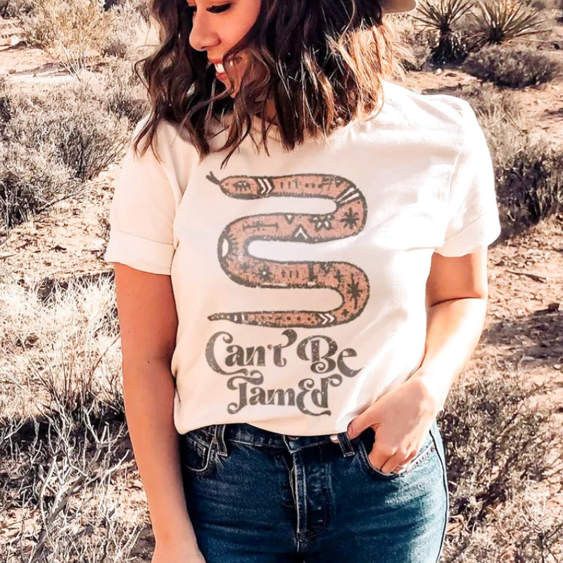 Online Exclusive | Can't Be Tamed Graphic Tee in White - Giddy Up Glamour Boutique
