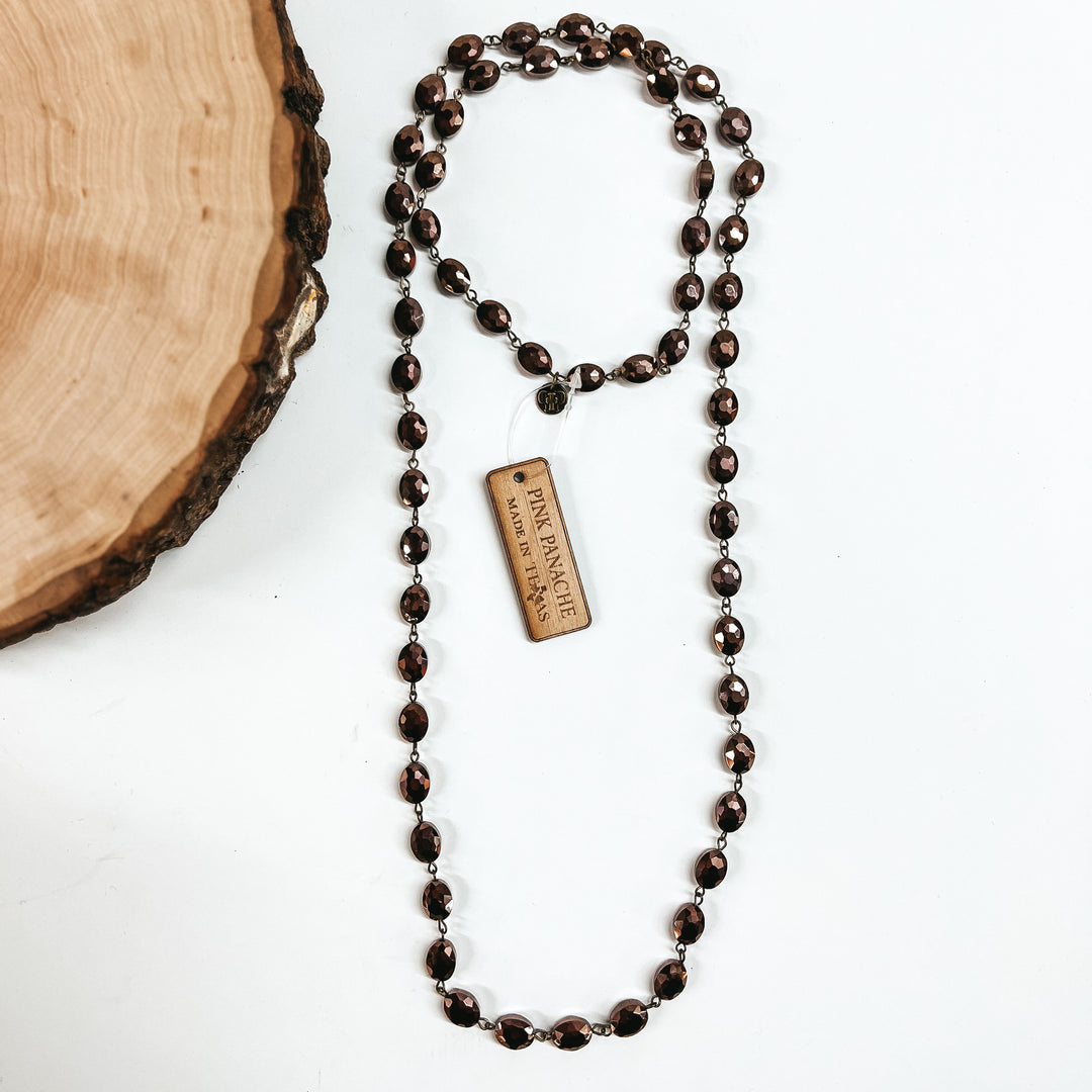 Pink Panache | Long Chocolate Flat Oval Crystal Beaded Necklace with Bronze Links - Giddy Up Glamour Boutique