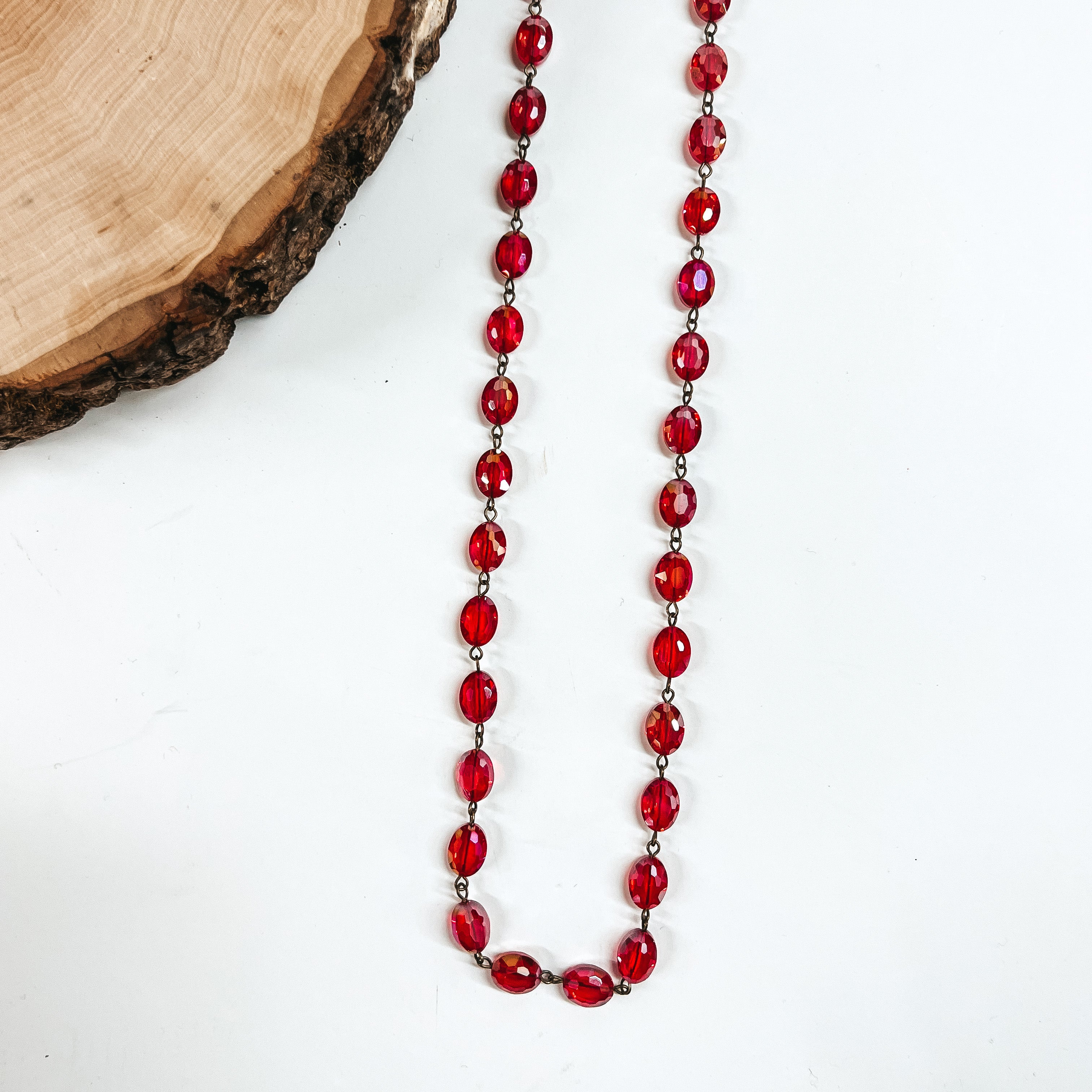 Pink Panache | Long Red Flat Oval Crystal Beaded Necklace with Bronze Links - Giddy Up Glamour Boutique
