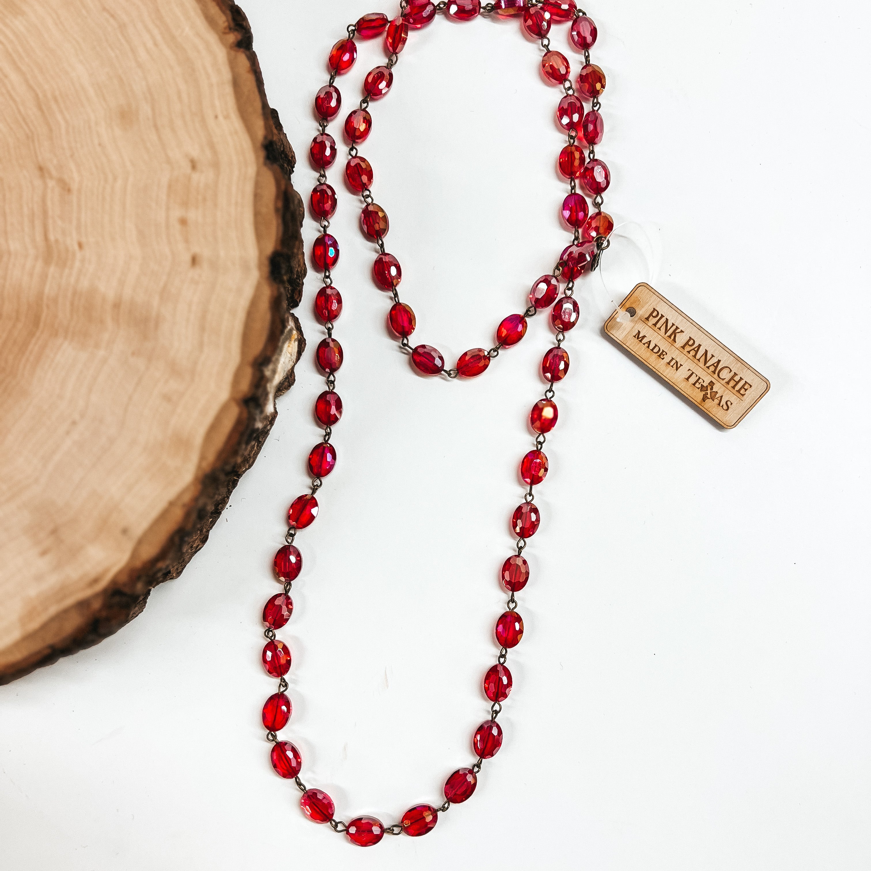 Pink Panache | Long Red Flat Oval Crystal Beaded Necklace with Bronze Links - Giddy Up Glamour Boutique
