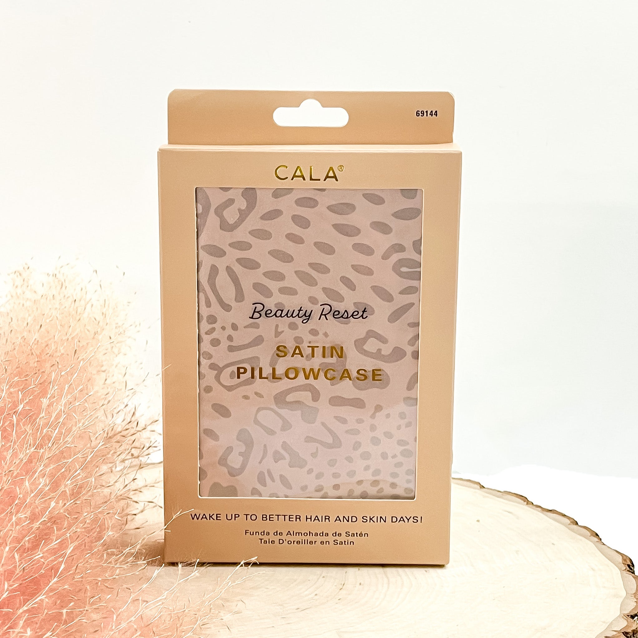 This is a cream colored box with a satin pillowcase inside in leopard print.