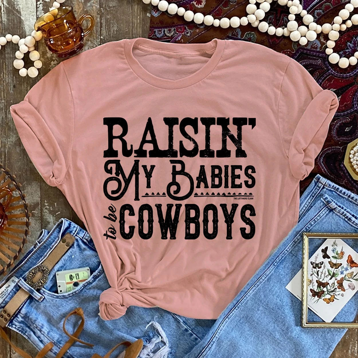 Online Exclusive | Raisin' My Babies To Be Cowboys Graphic Tee in Desert Rose - Giddy Up Glamour Boutique