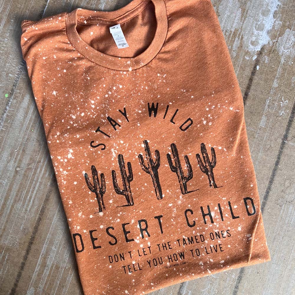 Online Exclusive | Stay Wild Desert Child with Cactus Short Sleeve Graphic Tee in Bleached Harvest - Giddy Up Glamour Boutique
